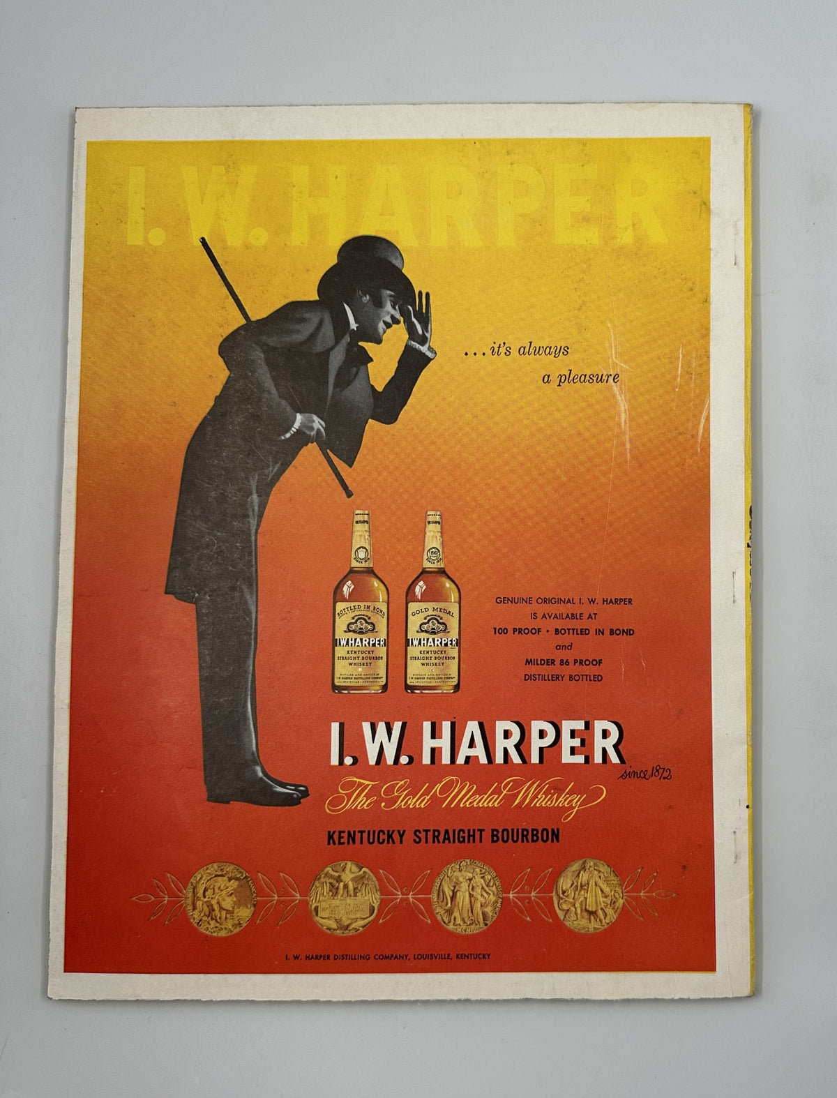 Classic I.W. Harper Bourbon advertisement from Esquire Magazine February 1956, highlighting the whiskey brand with a sophisticated silhouette and bold colors.