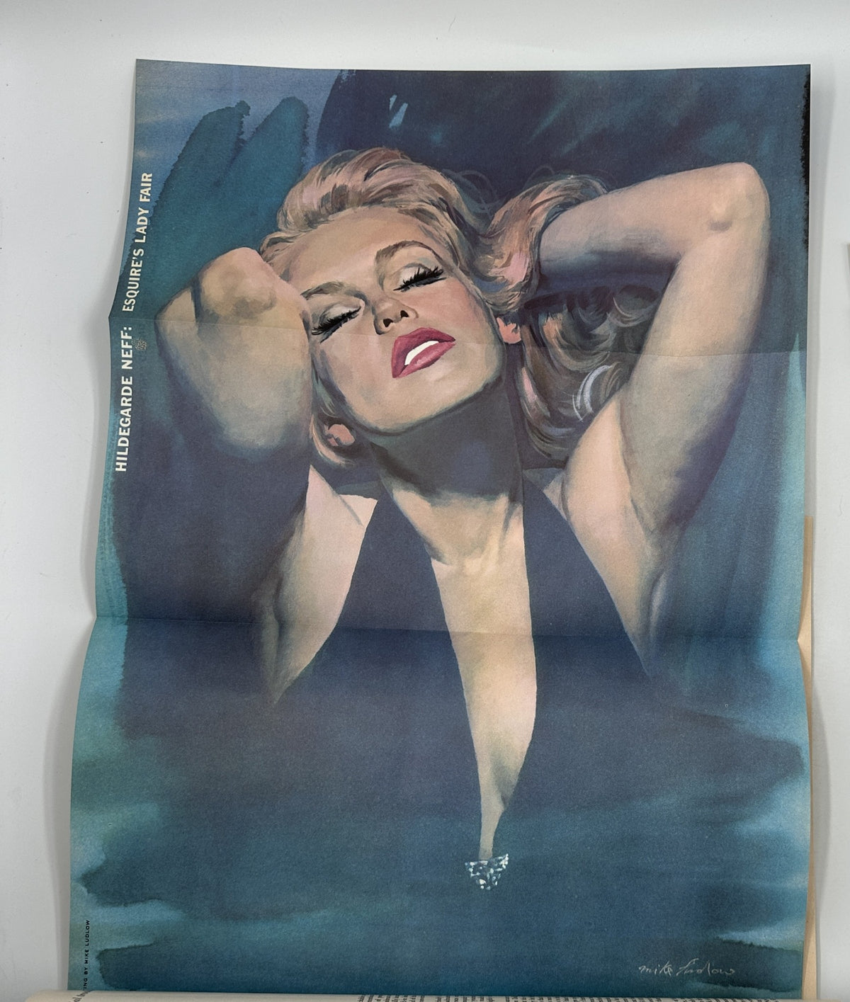 Esquire Magazine August 1956 cover featuring Hildegarde Neff in a pinup style, showcasing a glamorous and artistic portrait with striking colors and poses.