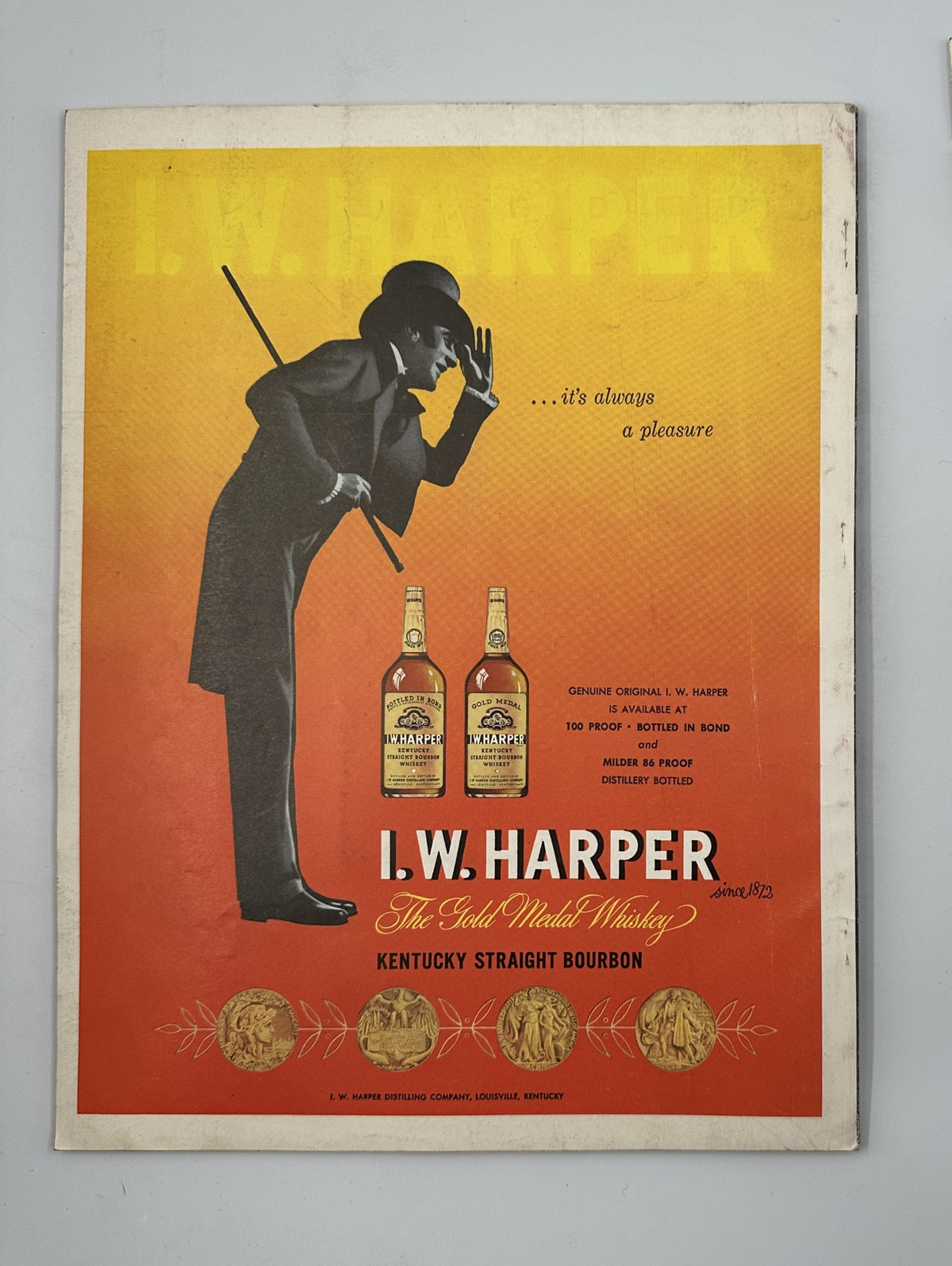 Advertisement for I.W. Harper bourbon in Esquire Magazine August 1956, featuring a sophisticated gentleman silhouette with vibrant colors and branding.