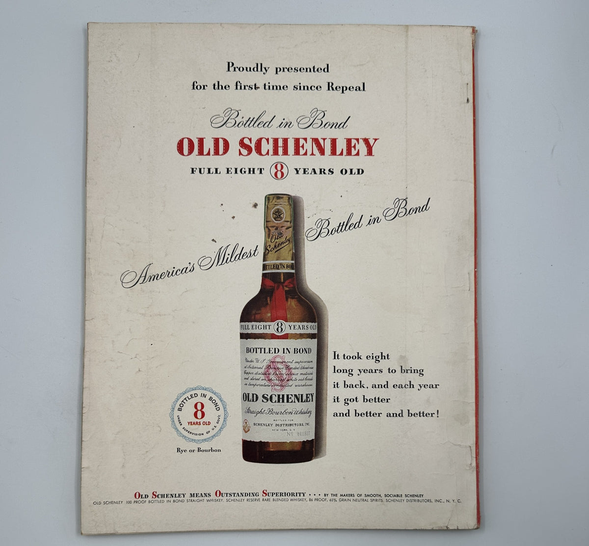 Esquire Magazine August 1950 presenting an advertisement for Old Schenley whiskey, emphasizing its smooth flavor and quality.