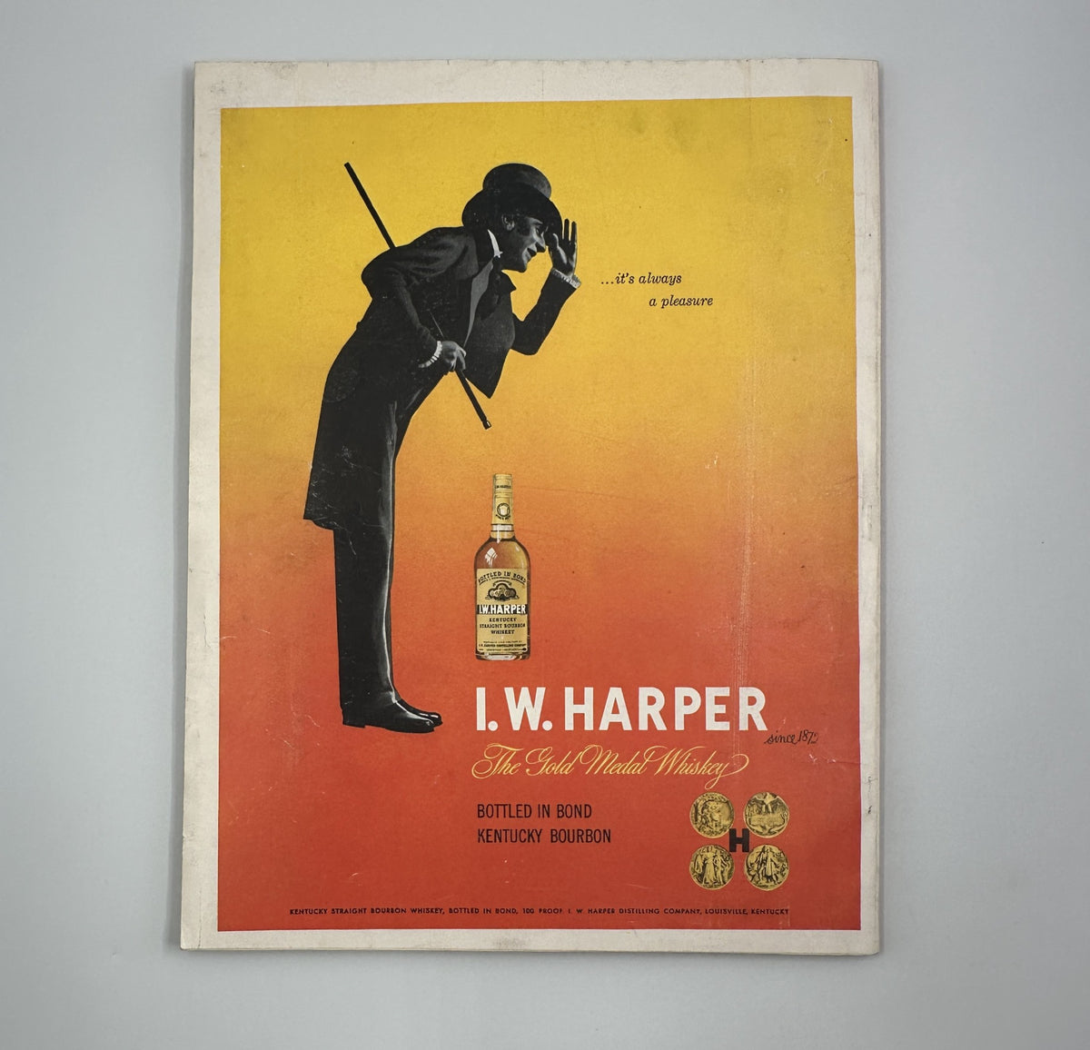 Cover of Esquire Magazine October 1950 featuring Robert C. Ruark's Football Special with a pinup, showcasing a vintage I.W. Harper bourbon advertisement with a silhouette of a man in a tuxedo.