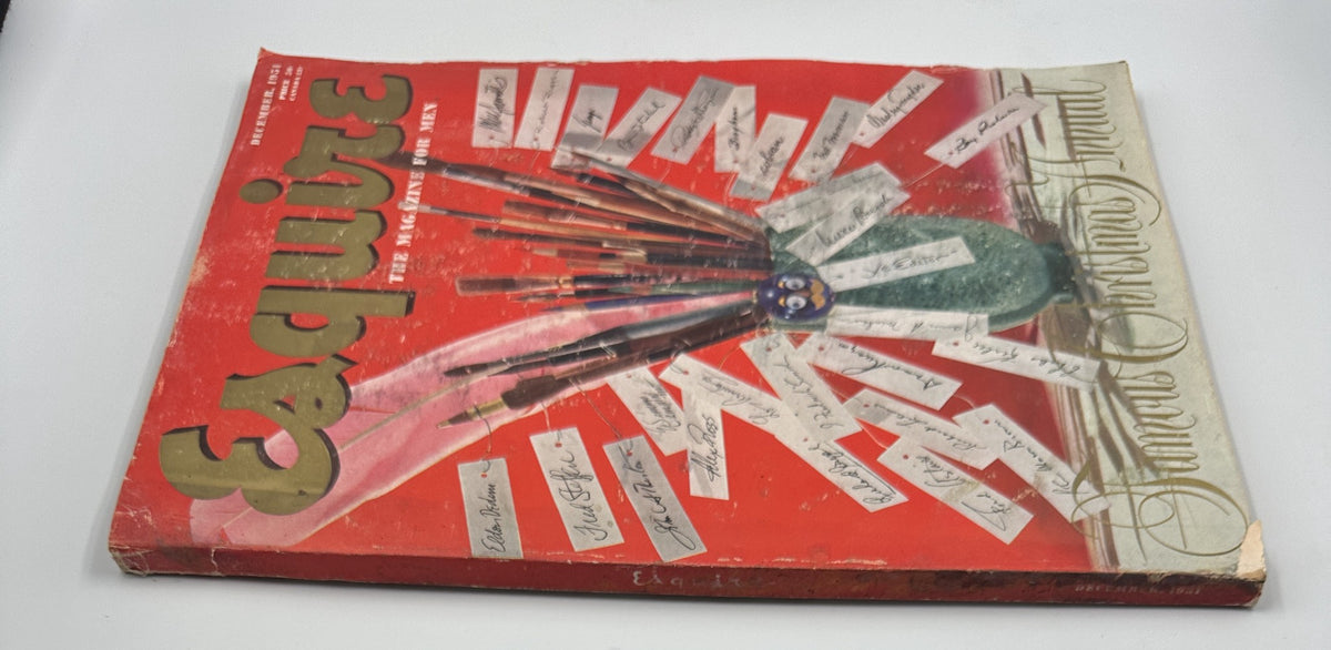 Another view of the cover of Esquire Magazine December 1951 highlighting a vibrant red background with a decorative arrangement of paintbrushes and Christmas-themed elements.