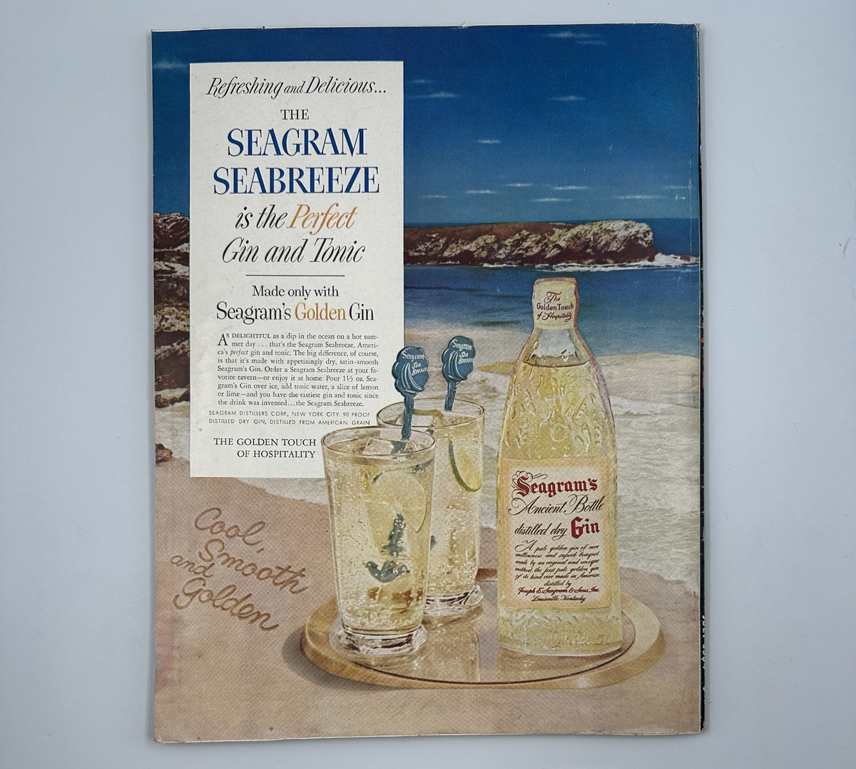 Vintage advertisement from Esquire Magazine July 1954, promoting the Seagram Seabreeze cocktail, featuring refreshing drinks served with Seagram's Golden Gin against a coastal backdrop.
