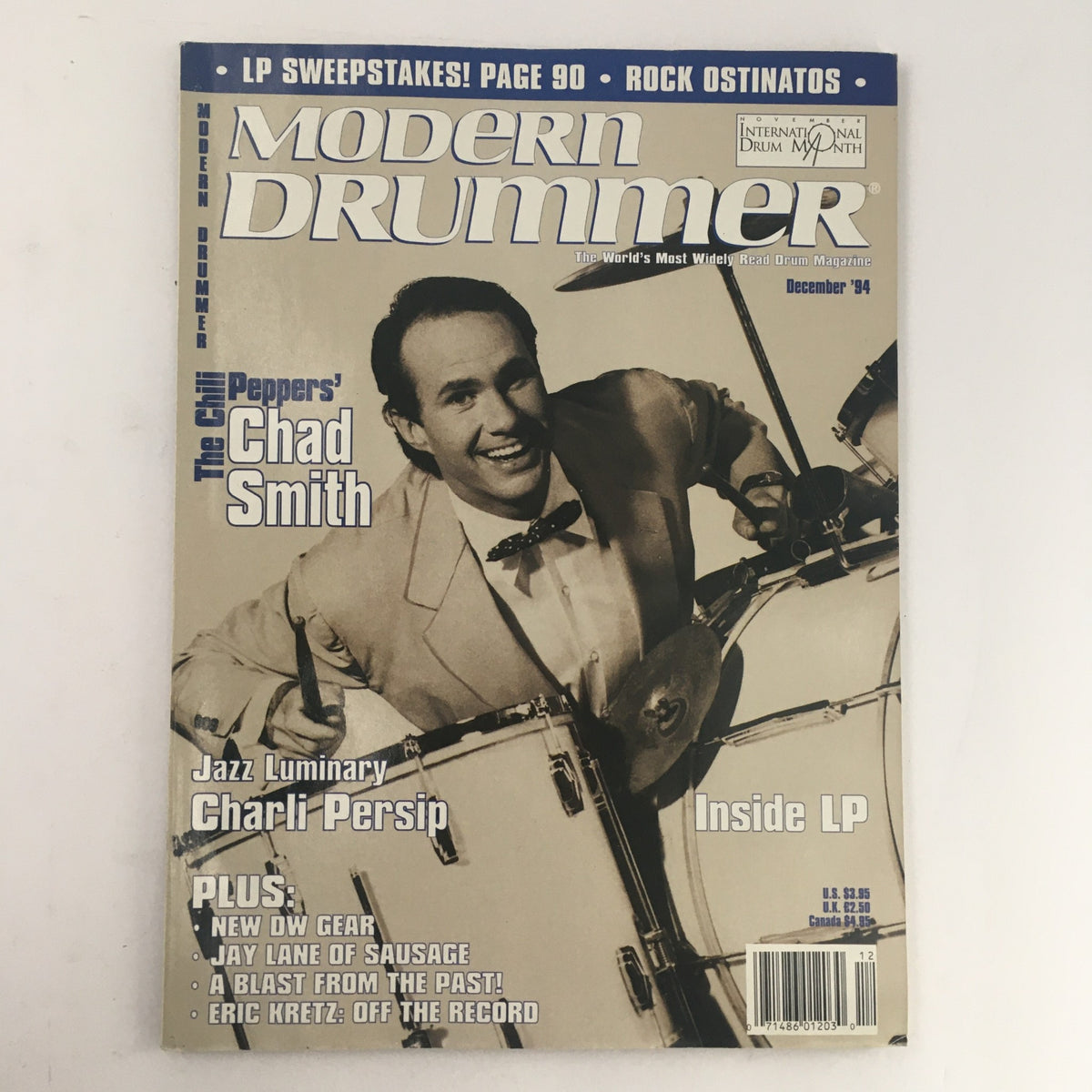 Modern Drummer Magazine December 1994 featuring Chad Smith from the Red Hot Chili Peppers and jazz drummer Charli Persip, showcasing drumming culture with insights and articles relevant to the era.