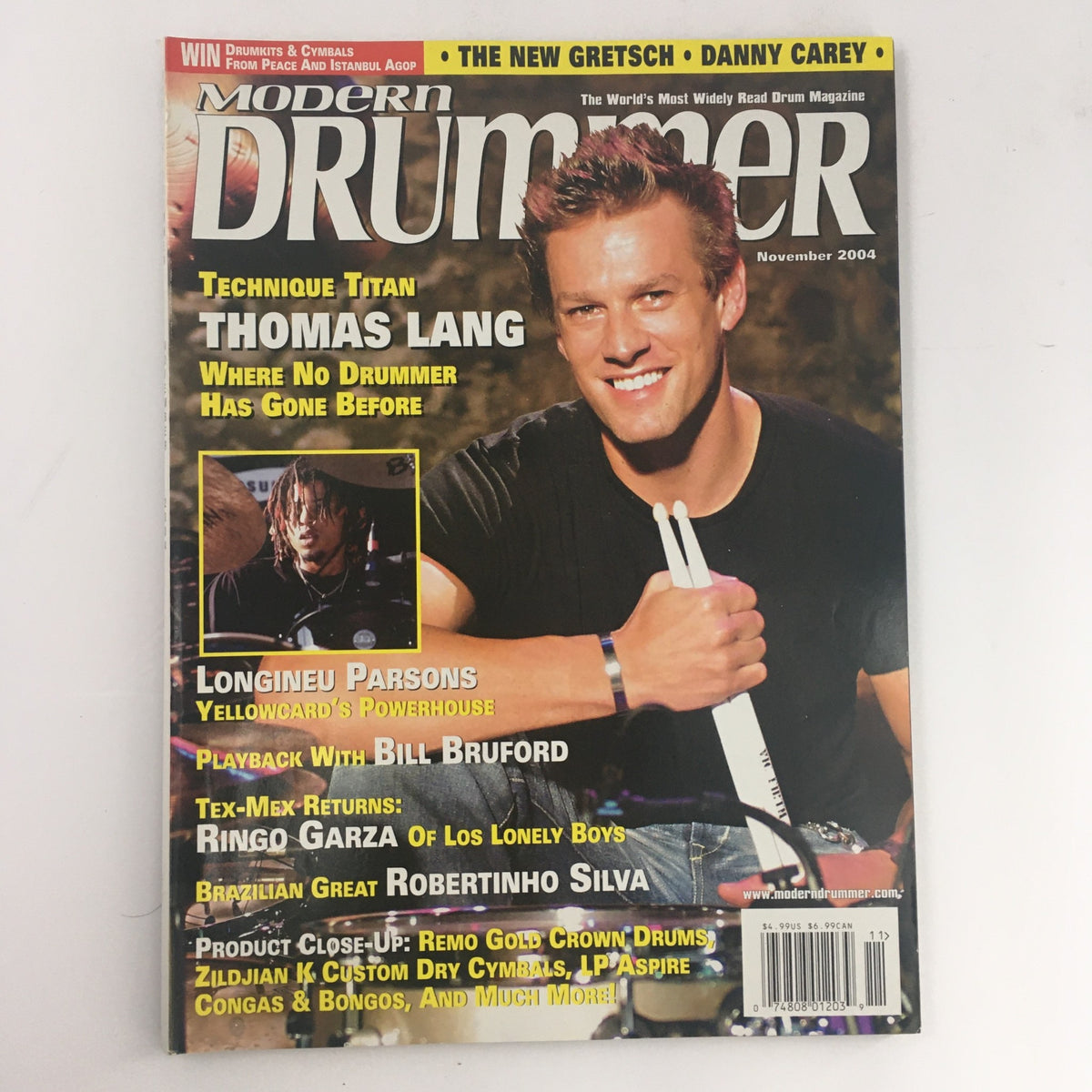 Modern Drummer Magazine November 2004 featuring Thomas Lang, showcasing highlights about drummers, including Longineu Parsons. Ideal for collectors and music enthusiasts.