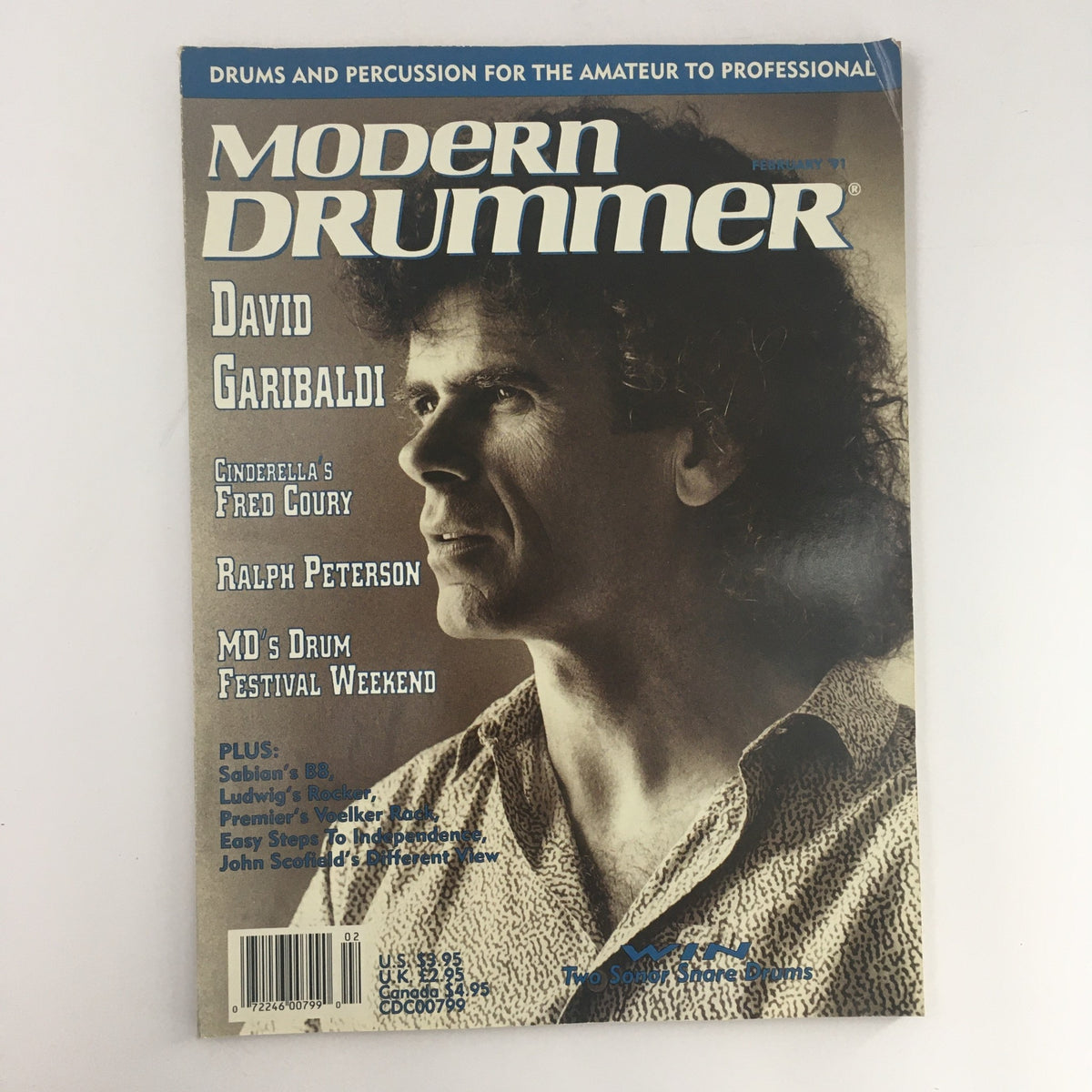 Modern Drummer Magazine February 1991 featuring David Garibaldi and Fred Coury on the cover, highlighting articles on drumming techniques and interviews with iconic musicians.