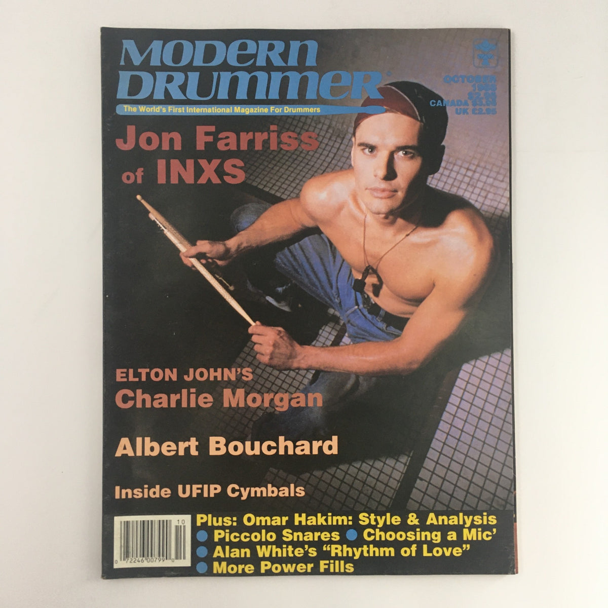 Cover of Modern Drummer Magazine October 1988 featuring Jon Farriss of INXS, Charlie Morgan, and Albert Bouchard, showcasing drumming insights and profiles of iconic musicians.