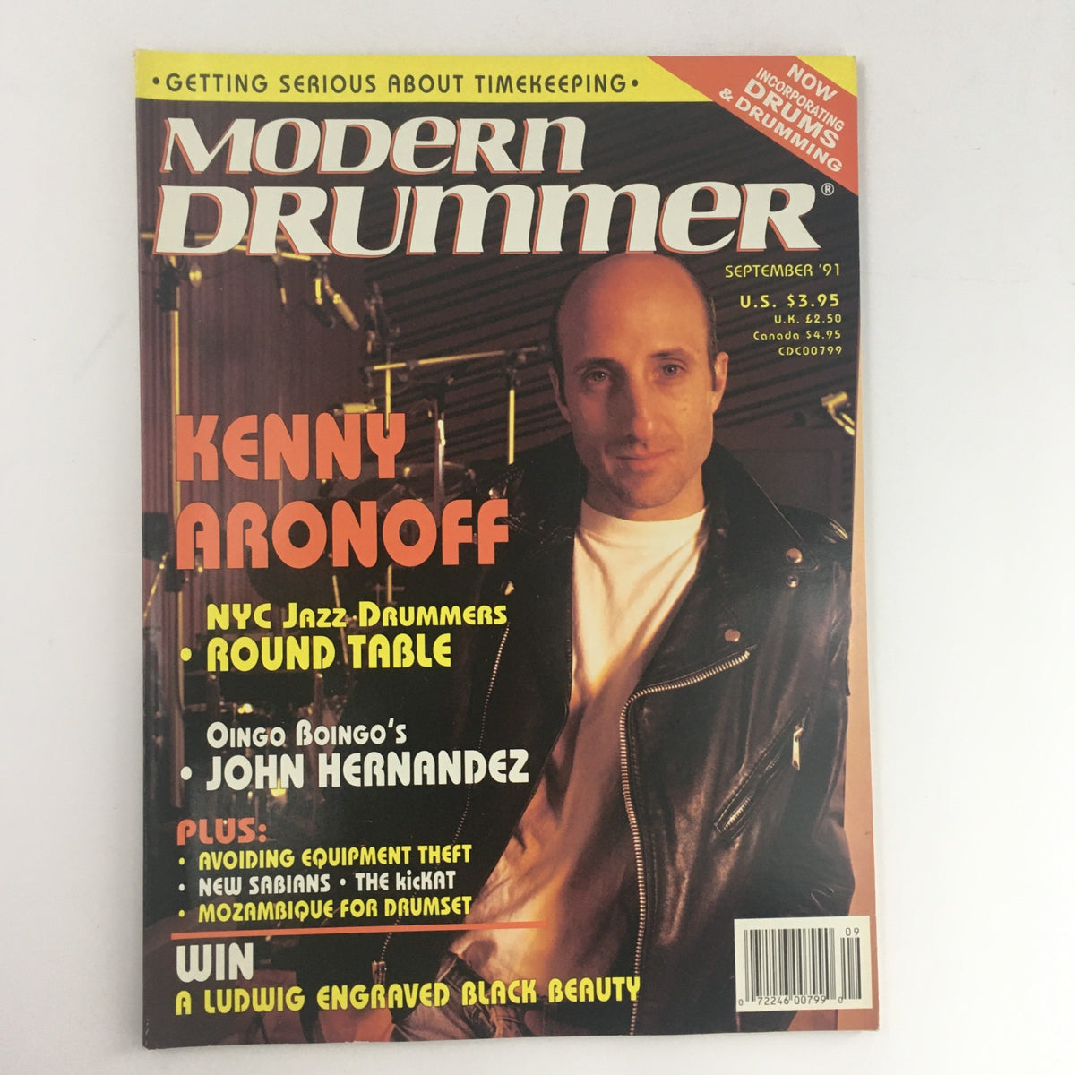 Cover of Modern Drummer Magazine September 1991 featuring Kenny Aronoff and John Hernandez, showcasing drumming topics and music history.