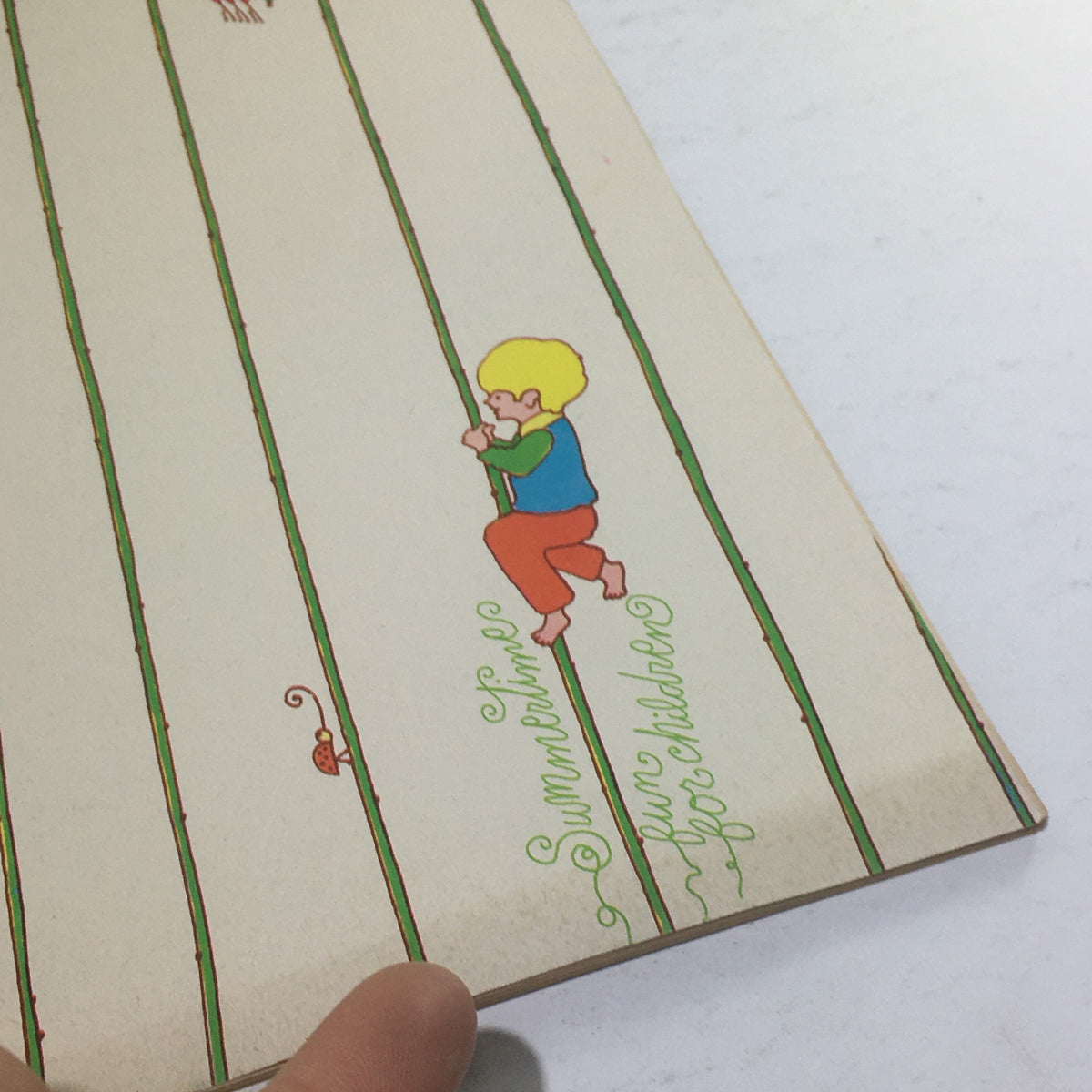 Close-up of the Cue Magazine: July 12 1969 cover showing a child climbing a flower stalk with 'Summertime Fun For Children' text, highlighting the vintage aesthetic.