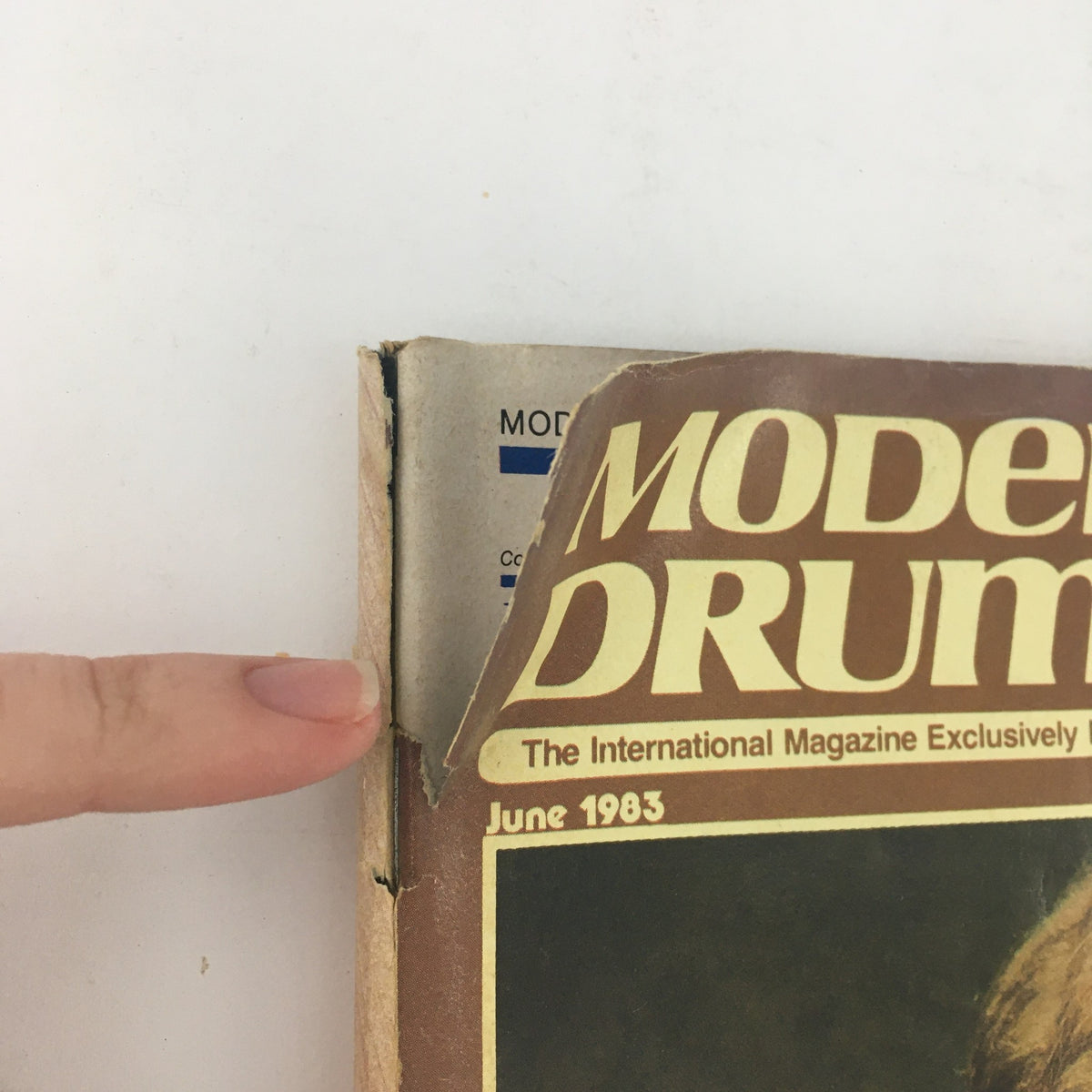 Side view of Modern Drummer Magazine June 1983 showing the spine and upper edge, indicating vintage wear and age.