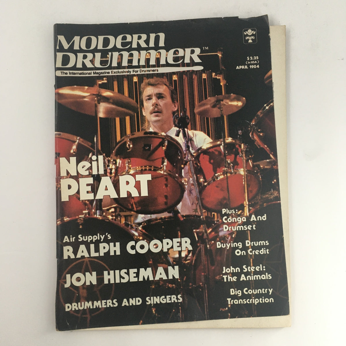 Cover of Modern Drummer Magazine, April 1984, featuring Neil Peart, Ralph Cooper, and Jon Hiseman