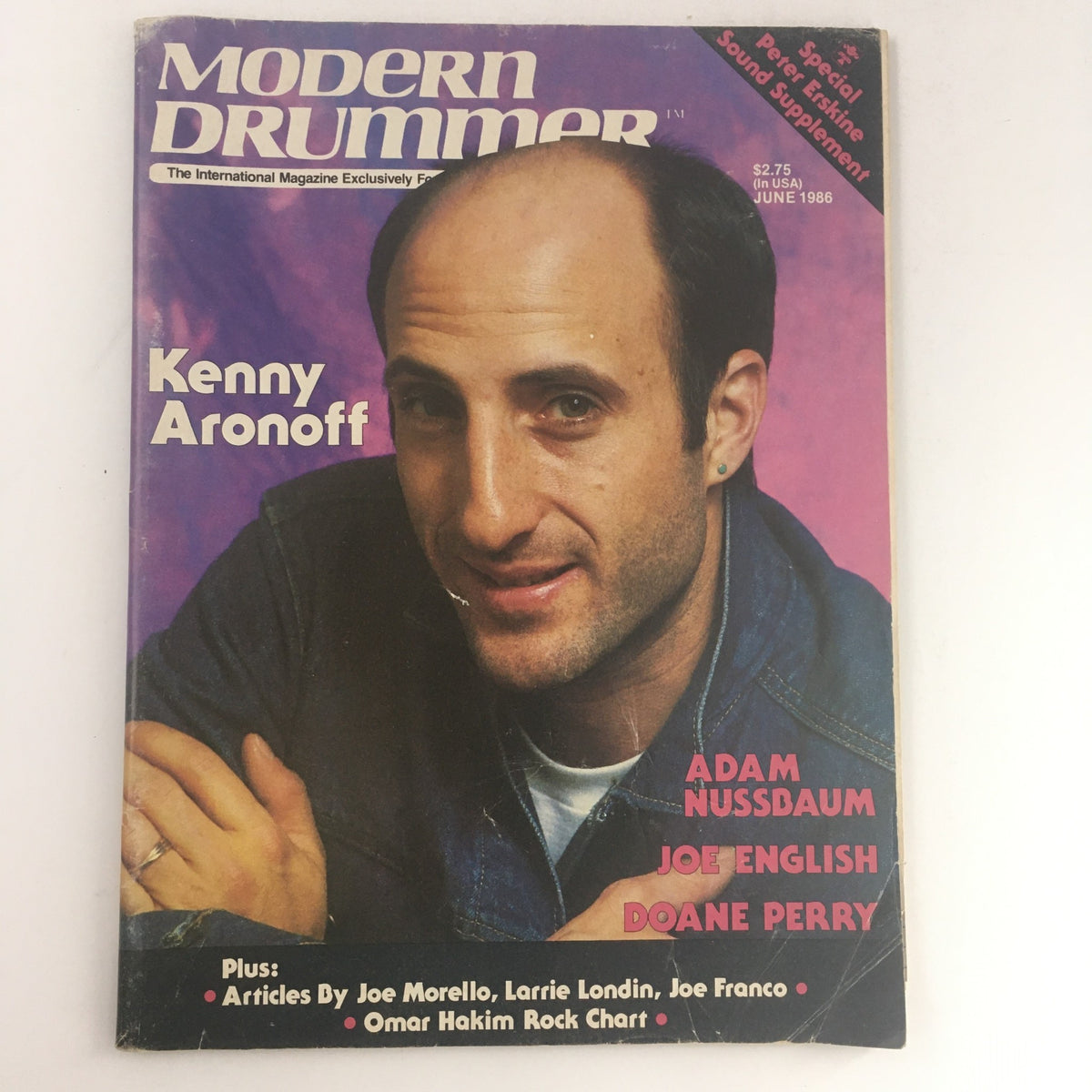 Cover of Modern Drummer Magazine, June 1986 featuring Kenny Aronoff, Adam Nussbaum, Joe English and Doane Perry, showcasing articles and drumming culture of the time.