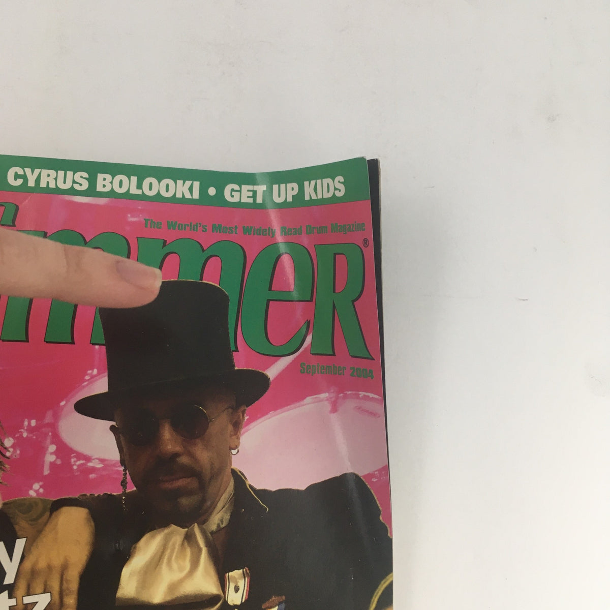 Cover of Modern Drummer Magazine September 2004 featuring Lenny Kravitz, Zoro, and Clarence Penn, showcasing the themes of drumming and rock music.