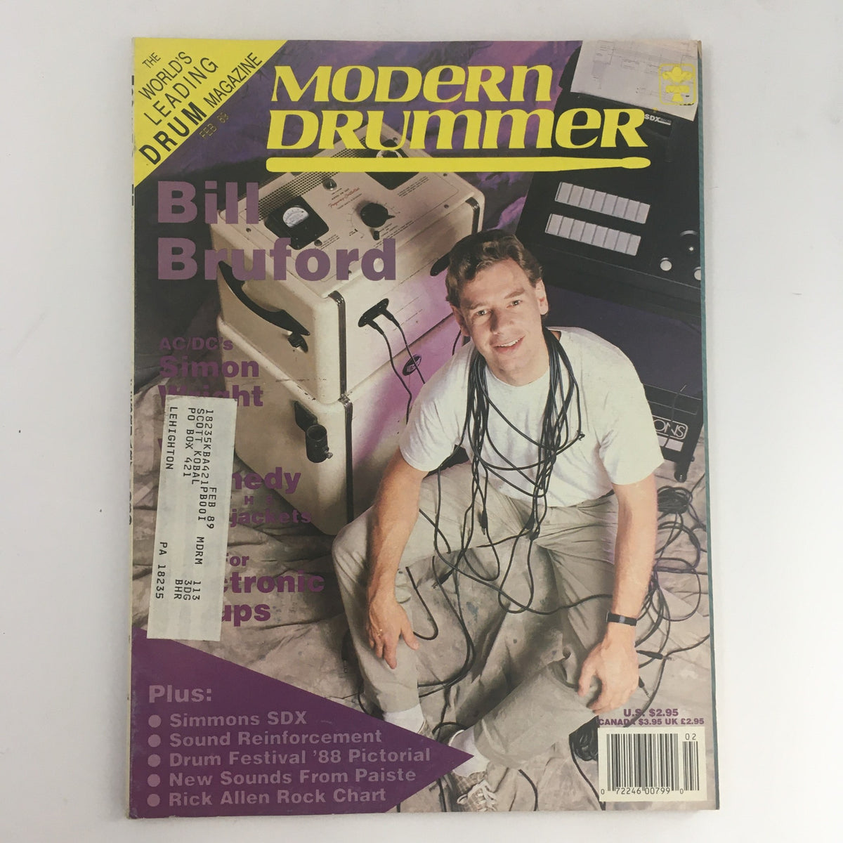 Cover of Modern Drummer Magazine February 1989 featuring Bill Bruford, showcasing him seated with drum equipment and cables, a collector's item for drumming enthusiasts.