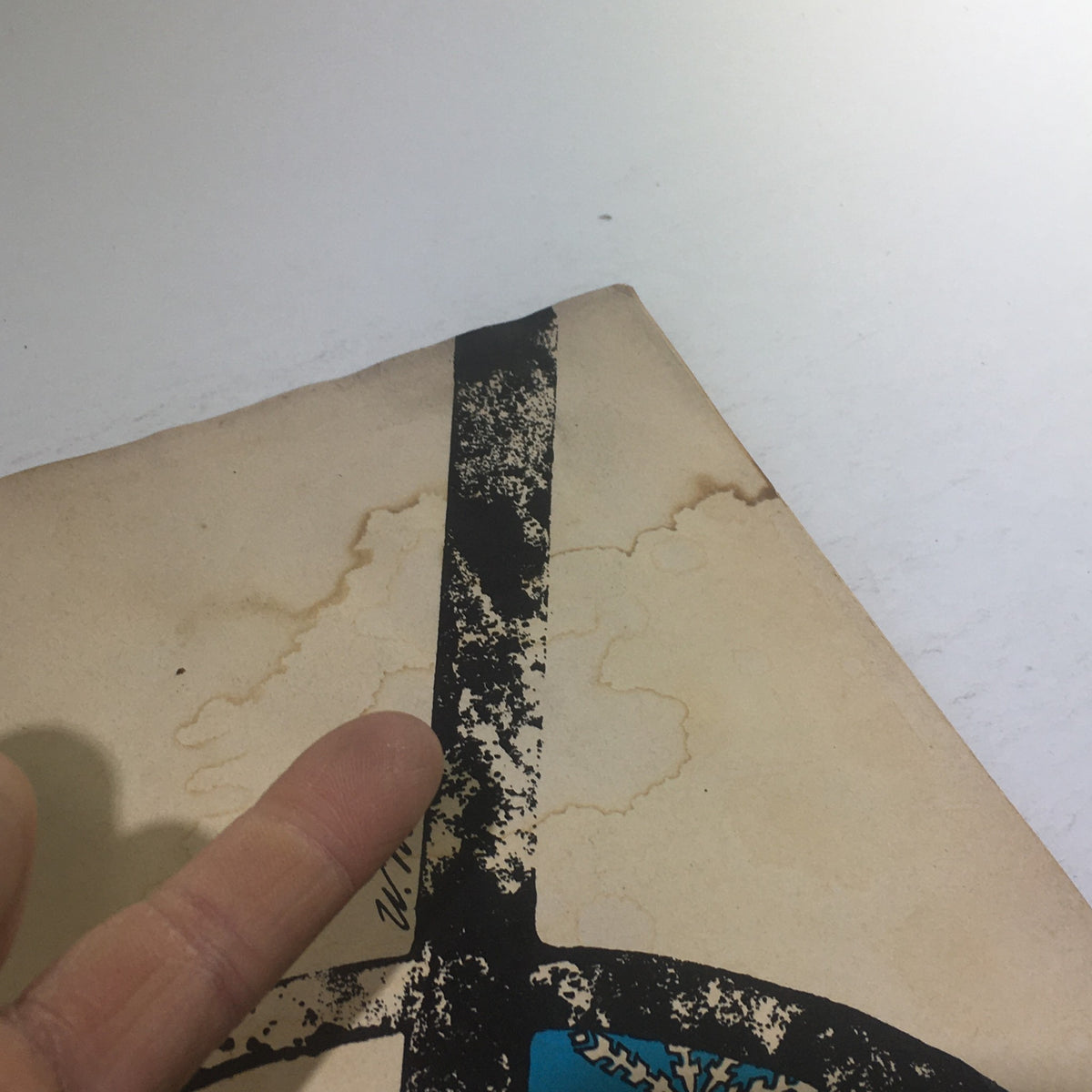 Close-up view of the corner of Cue Magazine: November 22 1969, showing minor wear and age spots on the cover. This highlights the vintage condition of the magazine, along with the unique theme cover by W. Minon.