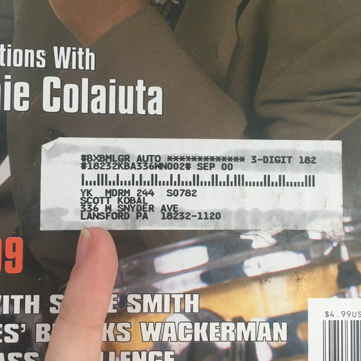 Close-up of the address label on the Modern Drummer Magazine November 1999 featuring Jeff 'Tain' Watts and Vinnie Colaiuta. The label adds authenticity to this collectible vintage magazine.