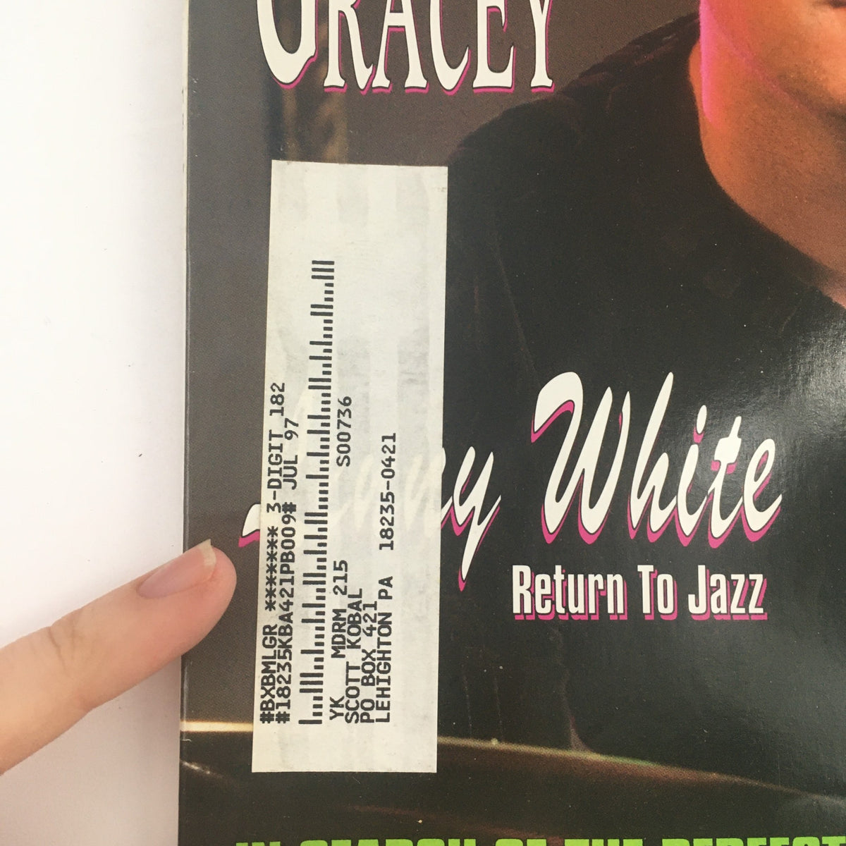 Close-up of the cover of Modern Drummer Magazine June 1997, showing Chad Gracey and Lenny White with a shipping label indicating July 1997, capturing a piece of drumming history.