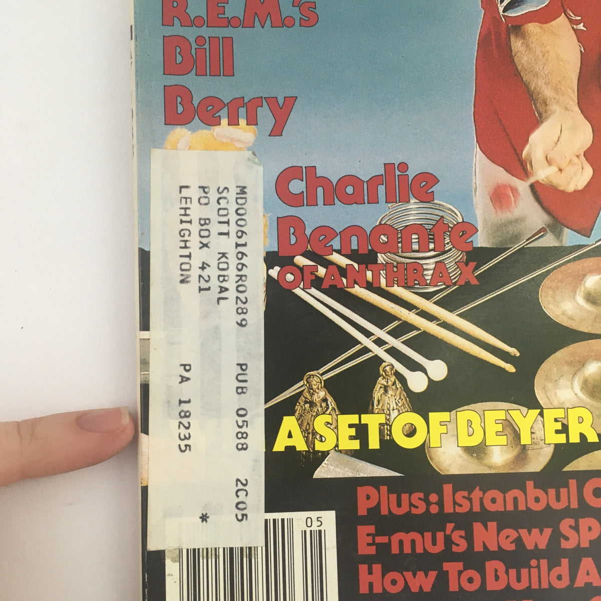 Cover of Modern Drummer Magazine, May 1988 featuring R.E.M.'s Bill Berry and Charlie Benante of Anthrax, showcasing drumming articles and interviews.