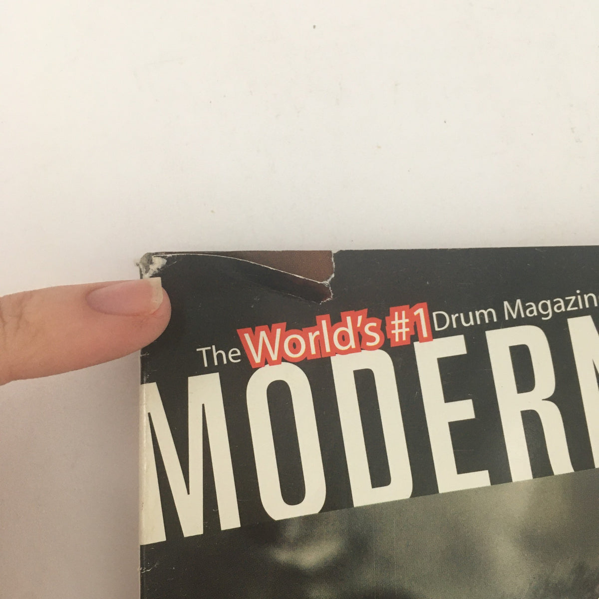 Corner detail of the Modern Drummer Magazine from June 2005, highlighting the phrase 'World's #1 Drum Magazine' along with a minor crease, indicating its vintage condition.