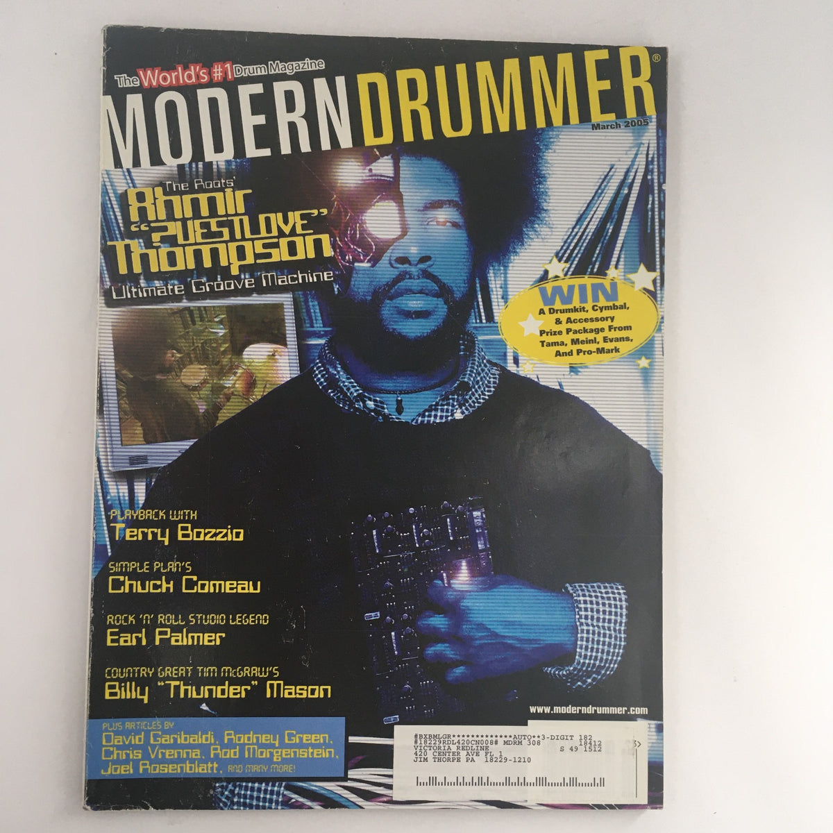 Cover of Modern Drummer Magazine March 2005 featuring Ahmir 'Questlove' Thompson, Terry Bozzio, and Chuck Comeau. This edition highlights iconic drummers with insightful articles and stunning photography.