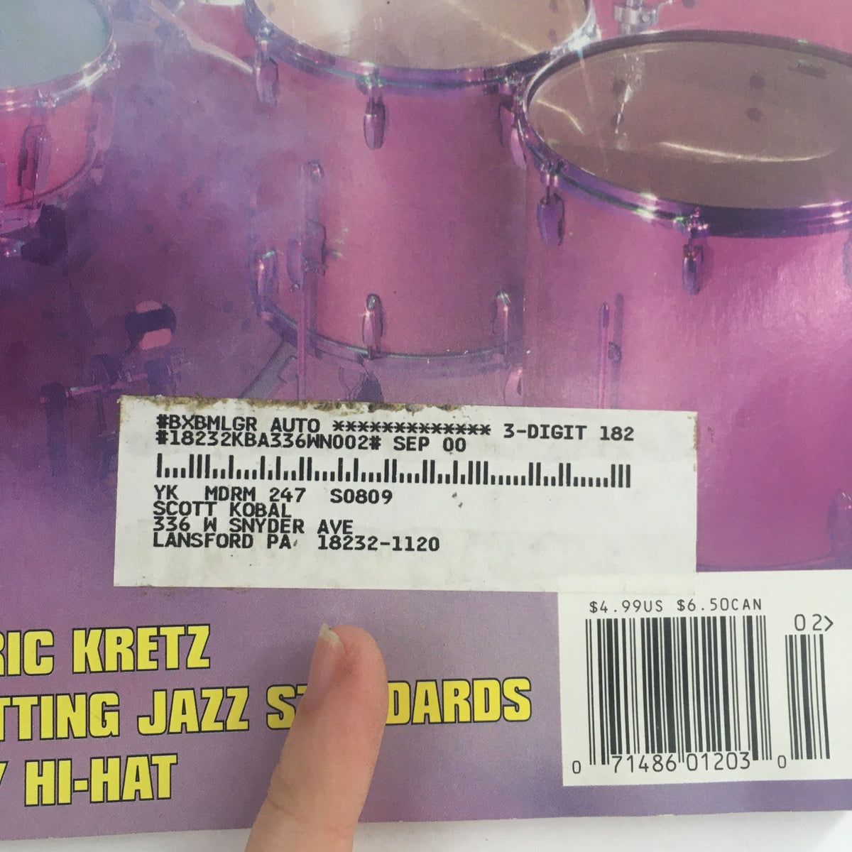 Back cover of Modern Drummer Magazine February 2000 displaying an address label and details of a previous registration, complementing the features of drummers Dave McLain, Eric Kretz, and Greg Hutchinson.