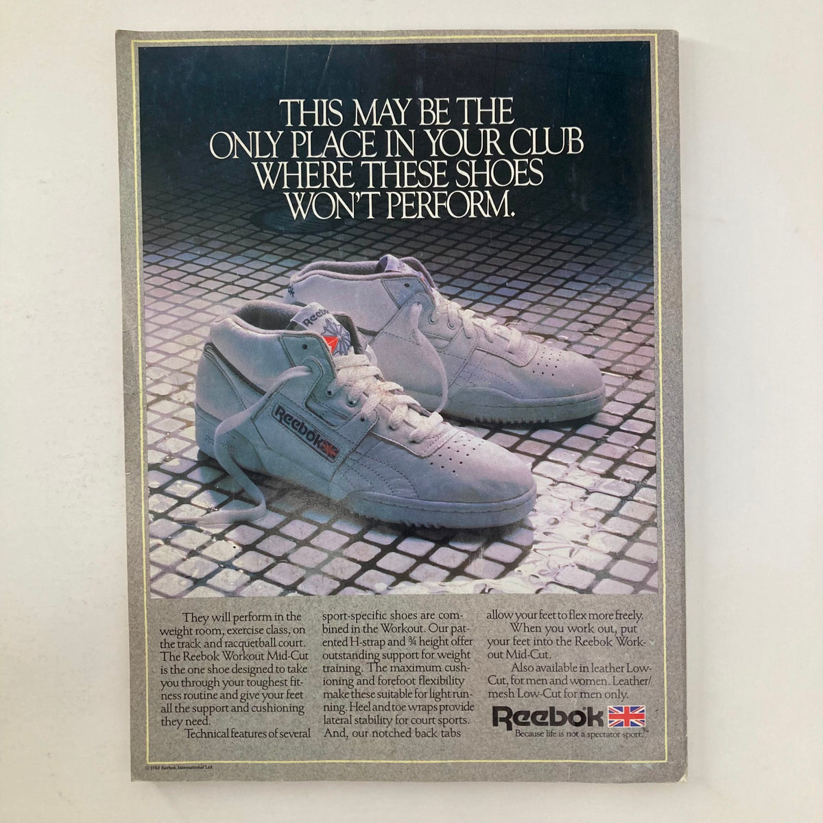Vintage advertisement for Reebok Workout Mid-Cut shoes featured in Joe Weider's Muscle & Fitness Magazine October 1986, showcasing the shoe design and performance features.