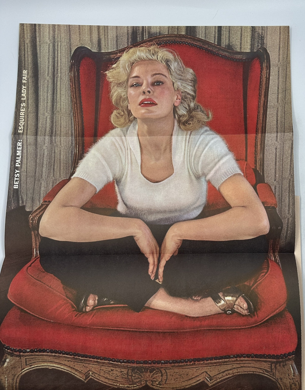 Foldout image of actress Betsy Palmer from Esquire Magazine November 1956, portraying her in a seated pose against a luxurious backdrop.