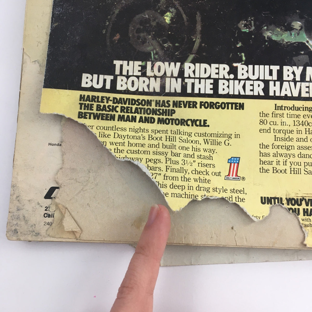 Damaged cover of Cycle Magazine April 1979 featuring 'The Low Rider' Harley-Davidson article. Shows wear and tear, reflecting its vintage appeal.