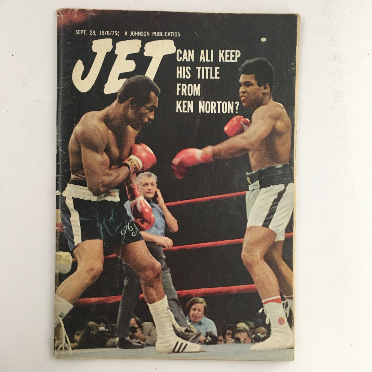 Cover of Jet Magazine from September 23, 1976 featuring a boxing match between Muhammad Ali and Ken Norton, with the headline asking if Ali can keep his title from Norton.