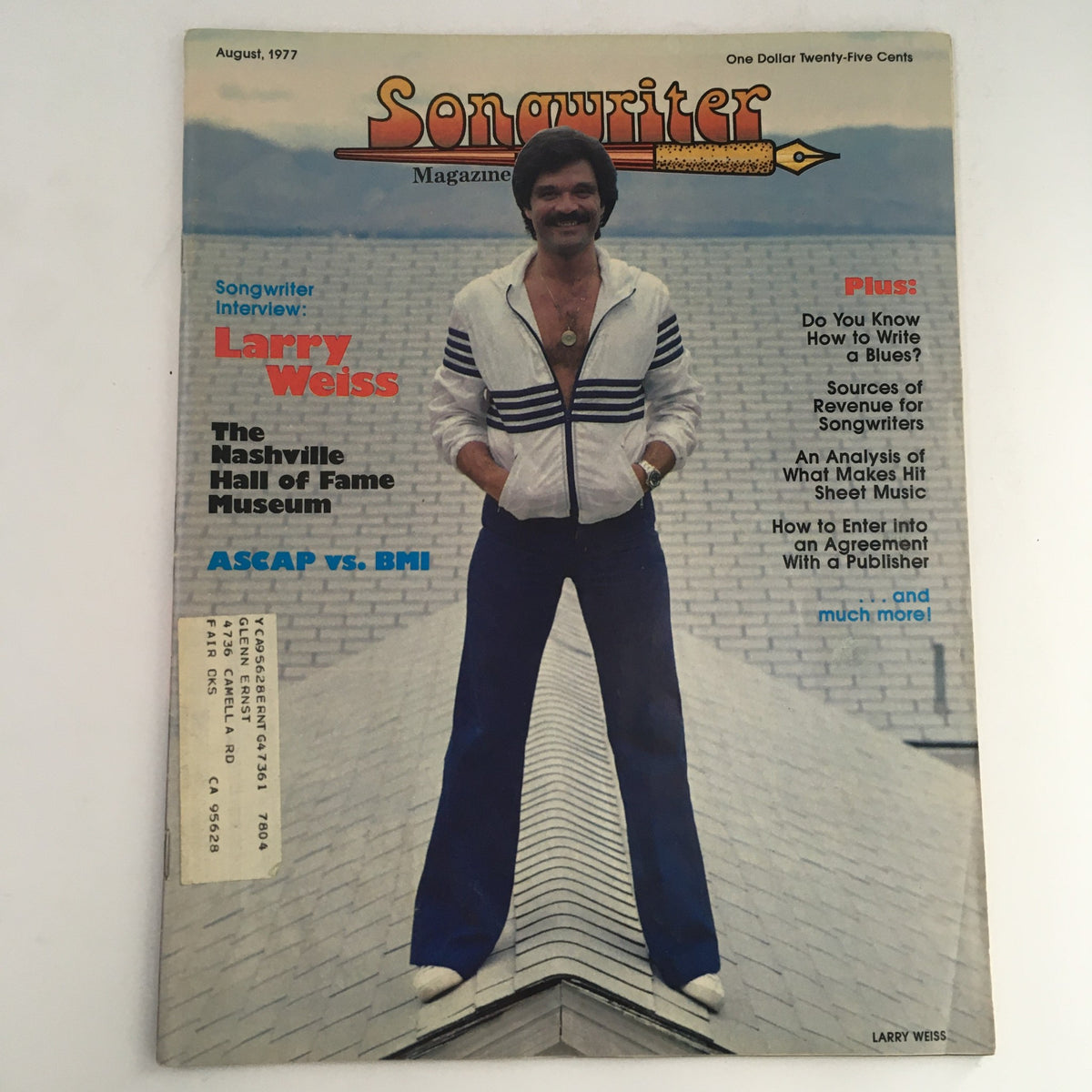 Cover of Songwriter Magazine August 1977 featuring an interview with Larry Weiss and a focus on the Nashville Hall of Fame. The cover displays Larry Weiss dressed in a stylish outfit against a brick background, highlighting the magazine's exploration of country music history.