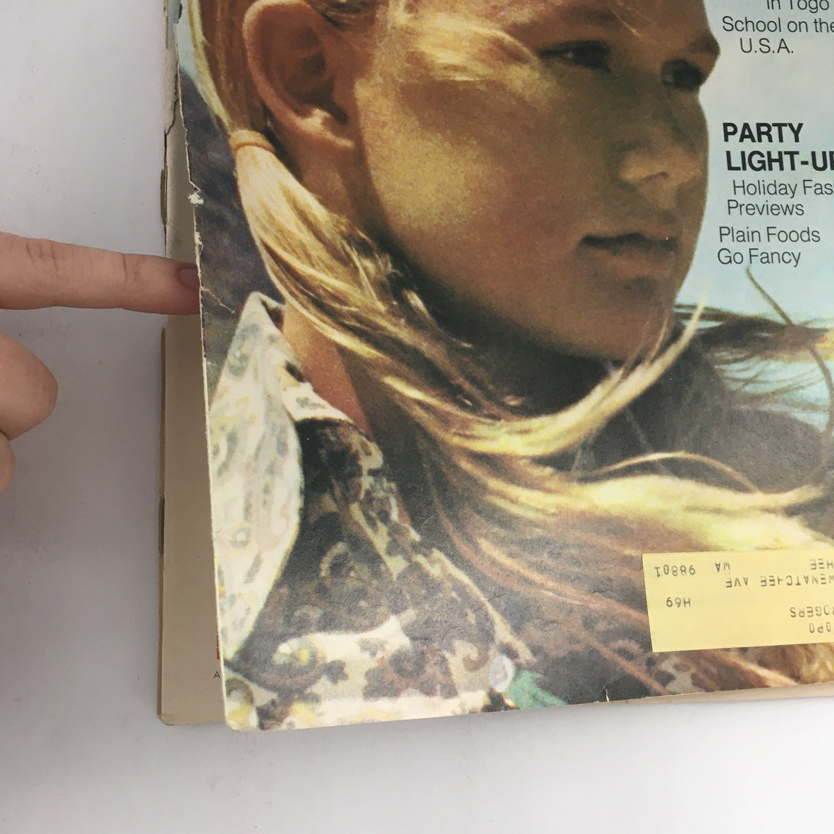 Corner detail of the cover of American Girl Magazine November 1969, displaying the girl's face and the magazine's title and theme.