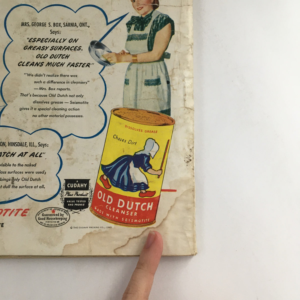 Back cover of McCall's Magazine February 1946 showcasing an advertisement for Old Dutch Cleanser, featuring a woman in a dress with a contrasting apron.