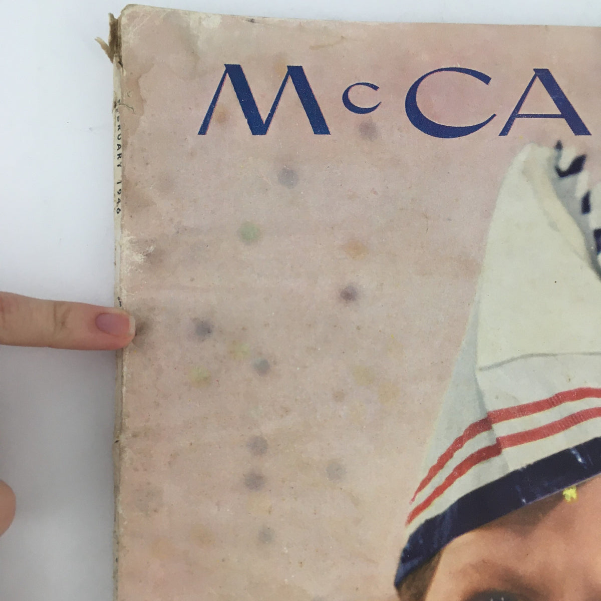 Close-up of the corner of McCall's Magazine February 1946, showing the wear and tear of the vintage publication, highlighting its historical value.