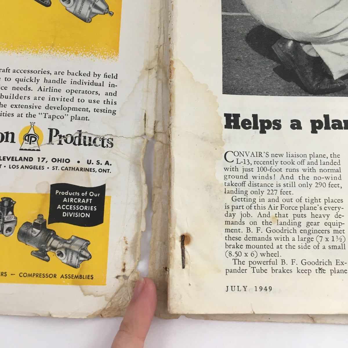 Interior view showing a page from Aero Digest, July 1949, discussing CONVAIR's liaison plane L-13 with technical information and vintage advertisements related to aviation engineering.