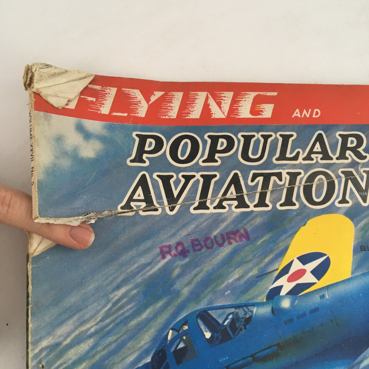 Close-up of the damaged top corner of the cover of Flying & Popular Aviation Magazine Vol 27 #5 from November 1940.