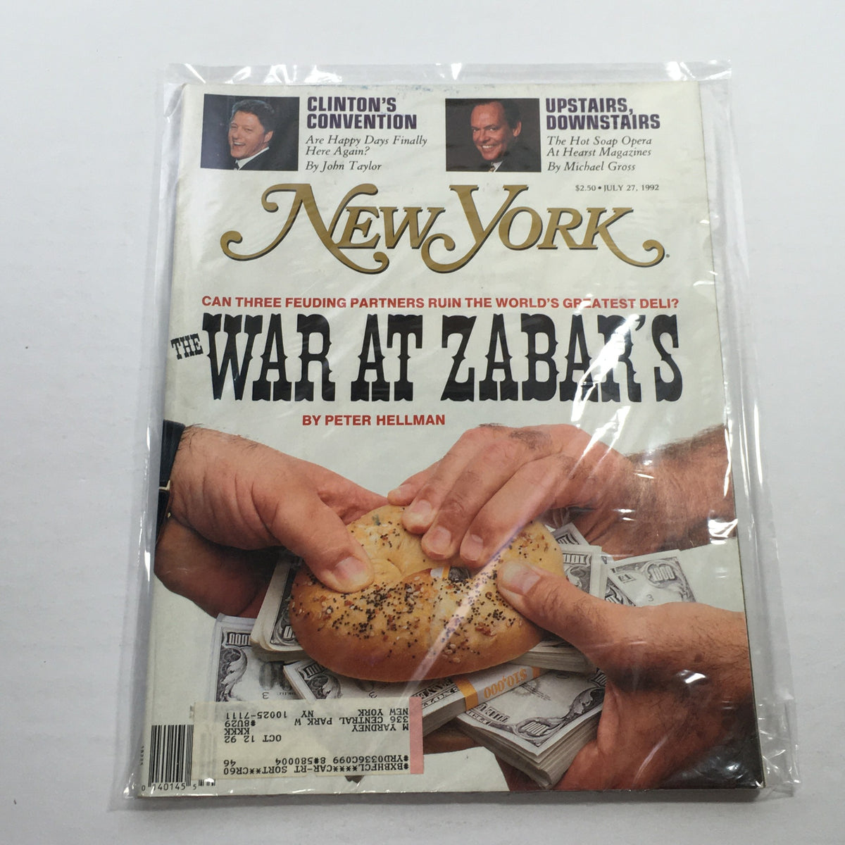 New York Magazine cover from July 27, 1992 featuring 'The War At Zabar's' by Peter Hellman, showcasing hands holding a bagel over dollar bills, highlighting the story of feuding partners at Zabar's.
