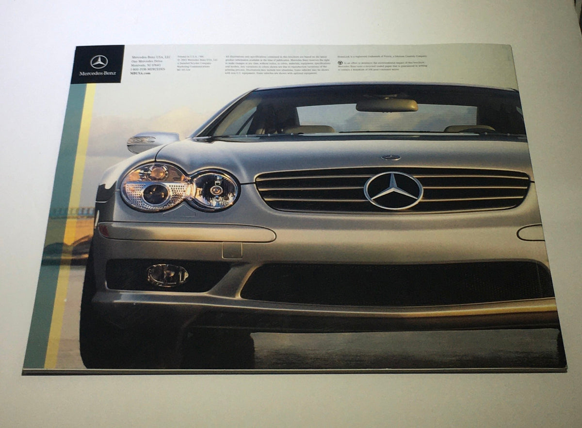 2004 Mercedes-Benz SL-Class 500 600 AMG Dealership Car Auto Brochure Catalog highlighting the striking front view of a silver Mercedes-Benz sports coupe.