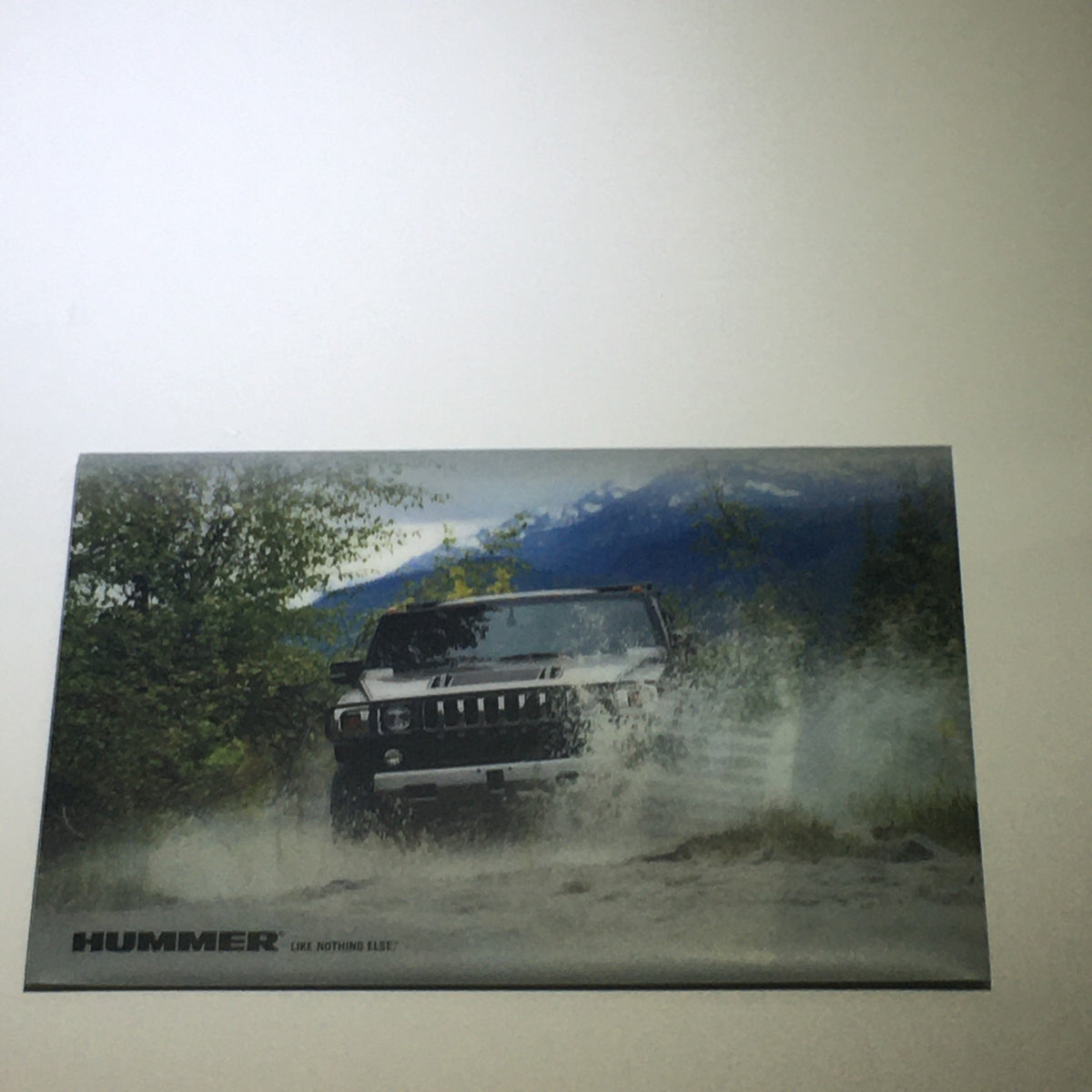 2008 Hummer H3 SUV Dealership Car Auto Brochure Catalog showing a Hummer driving through a muddy terrain, showcasing the vehicle's rugged features.