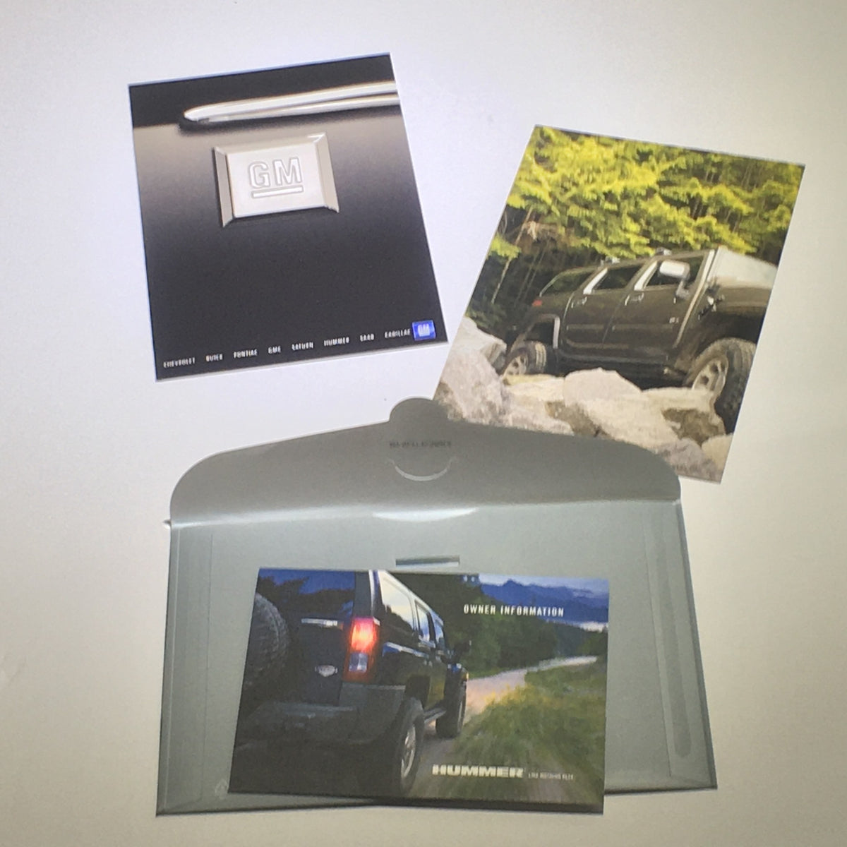 2008 Hummer H3 SUV Dealership Car Auto Brochure Catalog showcasing GM logo, owner information, and vehicle pictures on a sleek gray folder.