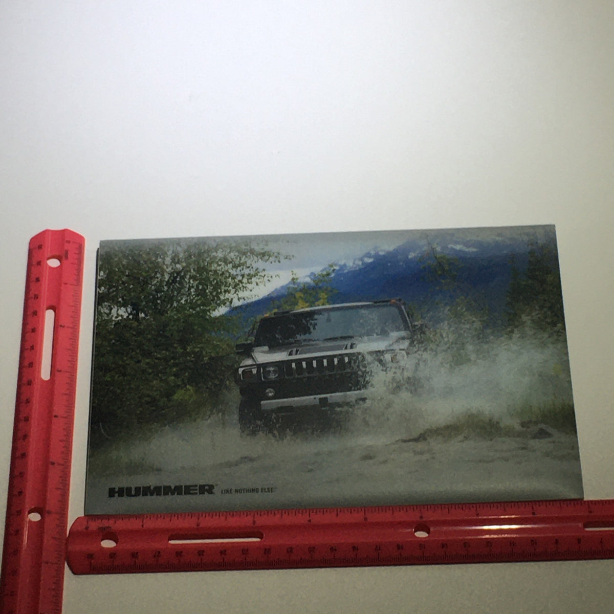 2008 Hummer H3 SUV Dealership Car Auto Brochure Catalog featuring an action shot of the vehicle in a rugged off-road setting, emphasizing its adventurous capabilities.