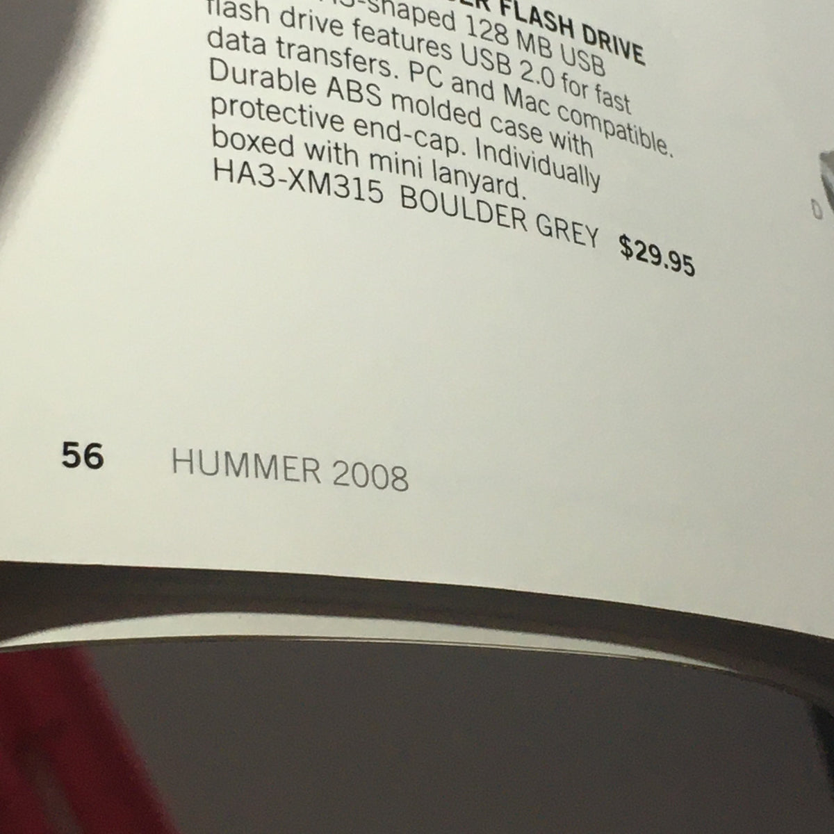 Close-up of a page from the 2008 Hummer Apparel+Vehicle Accessories Dealership Car Auto Brochure Catalog displaying a USB flash drive product description and pricing.