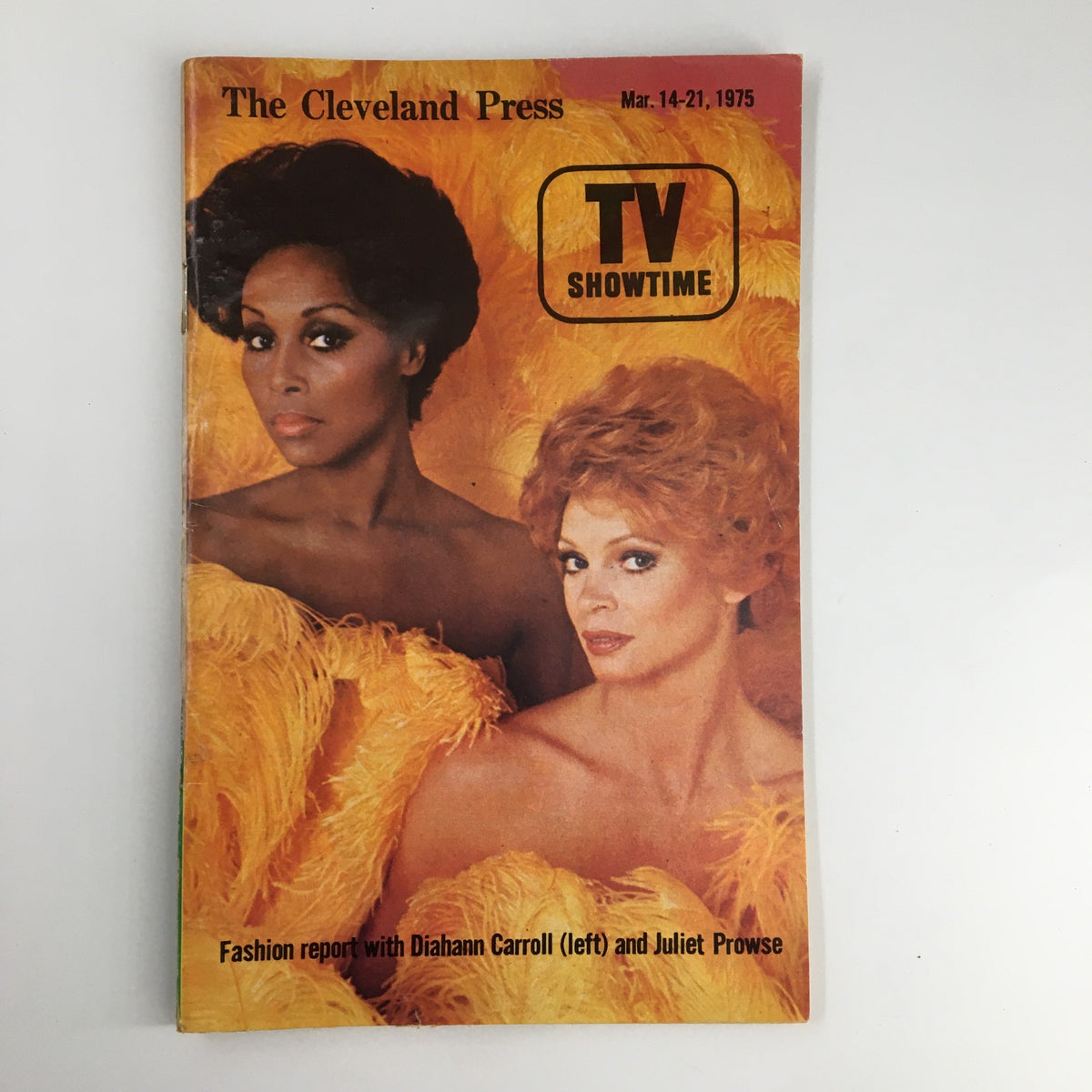 The Cleveland Press TV Showtime Guide March 1975 featuring a fashion report with Diahann Carroll and Juliet Prowse, showcasing vibrant feathered outfits.