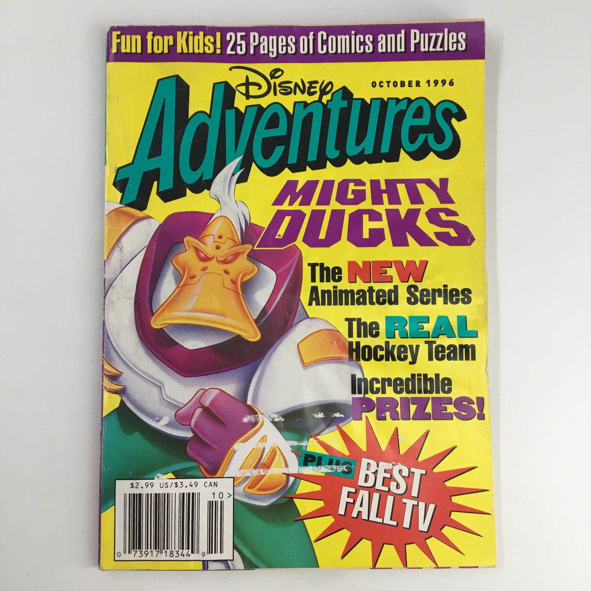 Disney Adventures Magazine October 1996 featuring Mighty Ducks The New Animated Series, showcasing vibrant cover art with characters and promotional highlights for comics and puzzles.