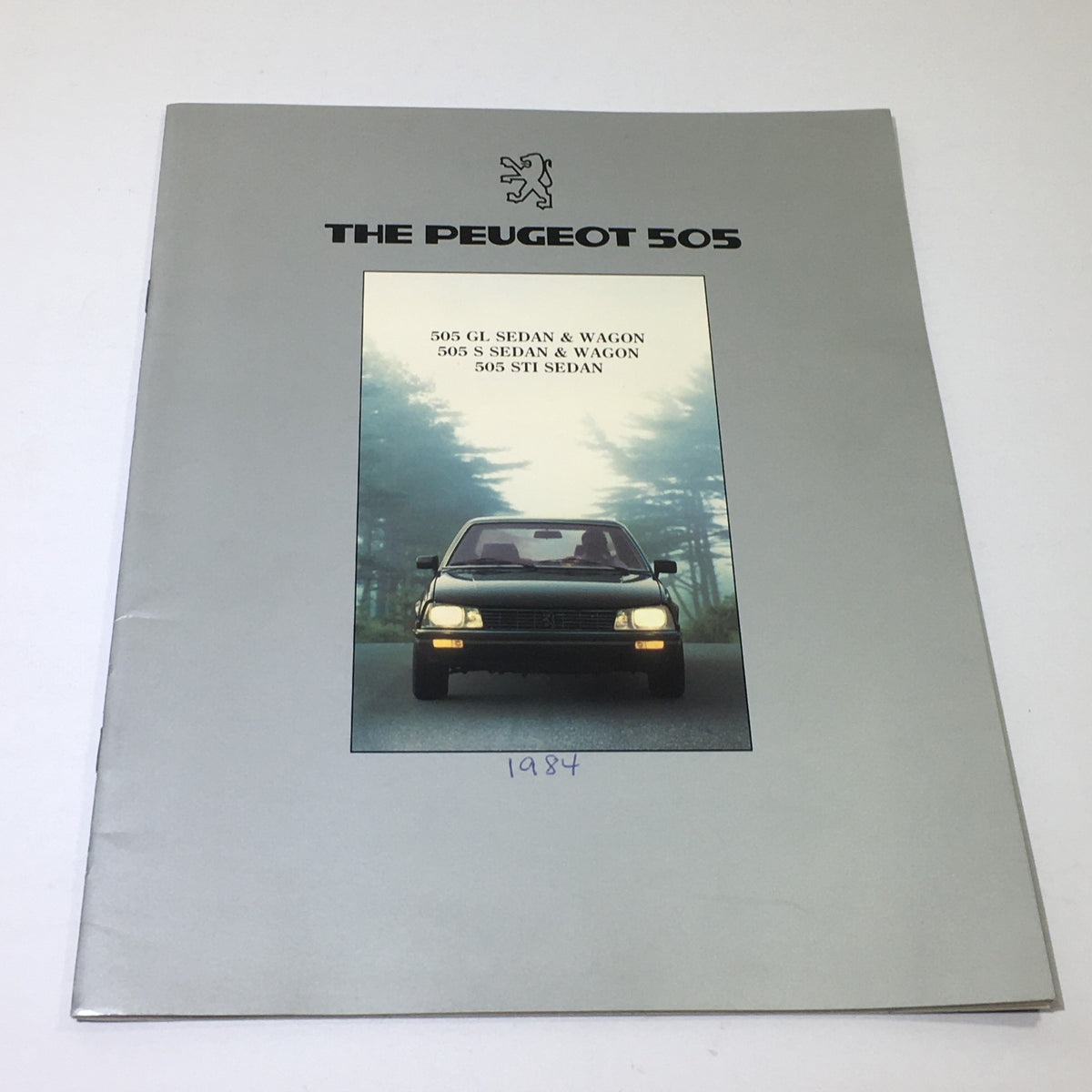 1984 Peugeot 505 GL Sedan and Wagon Dealership Car Auto Brochure Catalog cover featuring the car against a forest background.