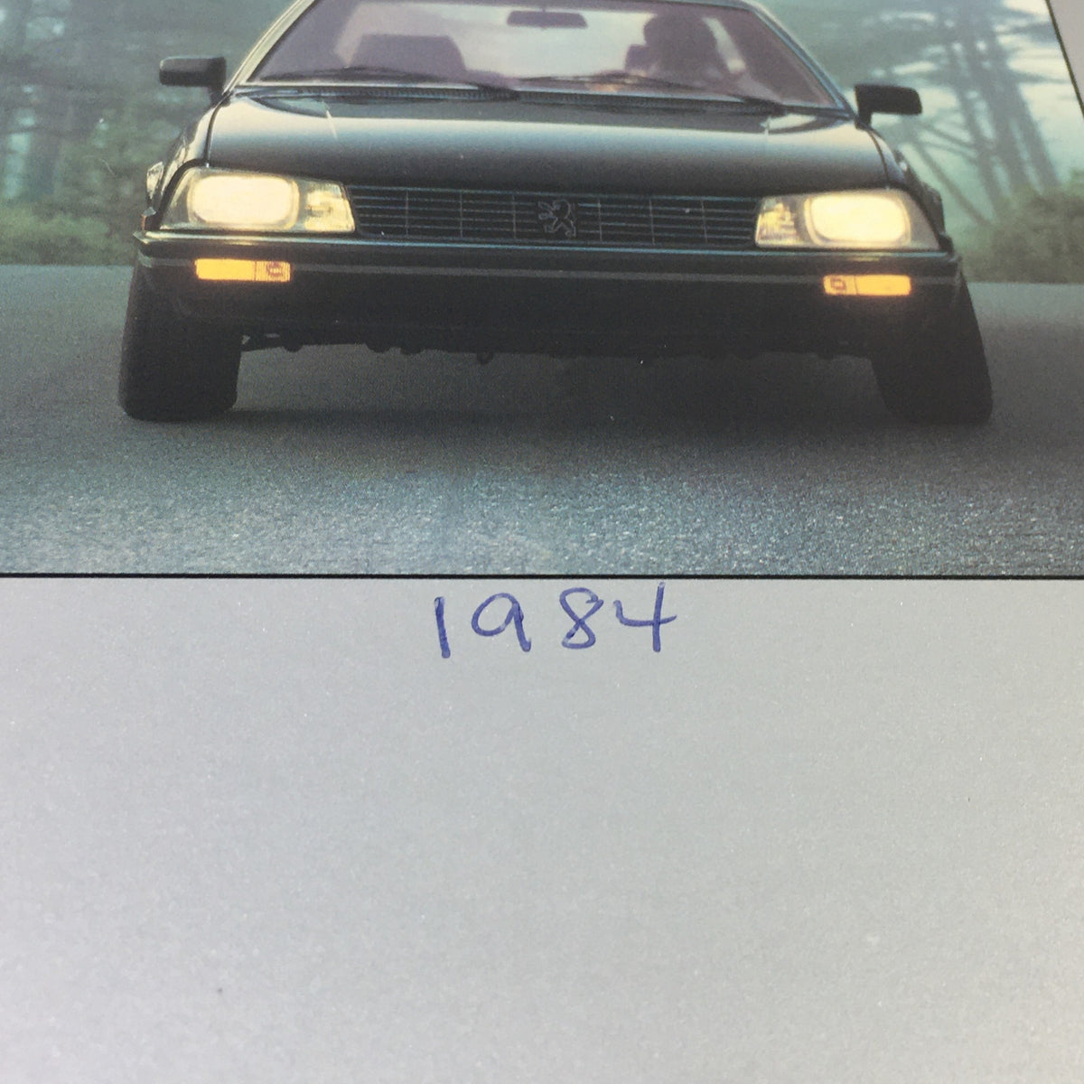 Close-up of the 1984 Peugeot 505 GL with a focus on the front view, showcasing its sleek design.