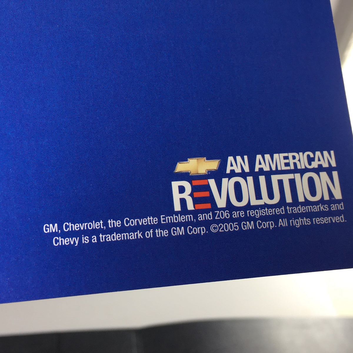 Detail from the 2006 Chevrolet Corvette HP 505 Accessories Brochure showing the American Revolution branding with GM logo.