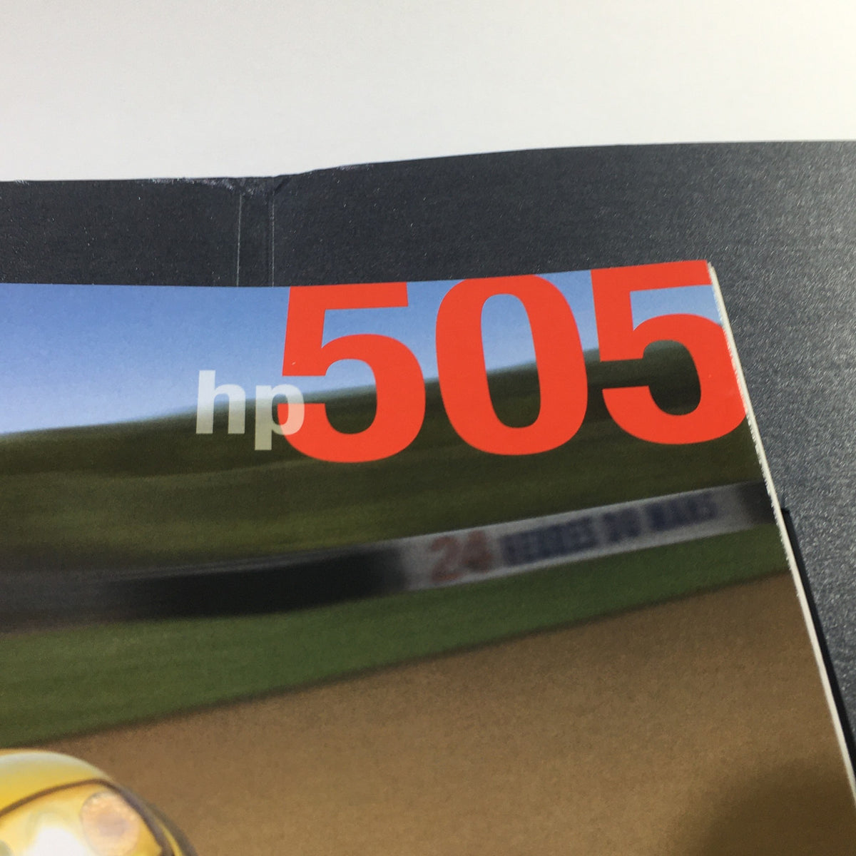 Close-up of the HP 505 title on the 2006 Chevrolet Corvette Accessories Brochure highlighting performance specifications.