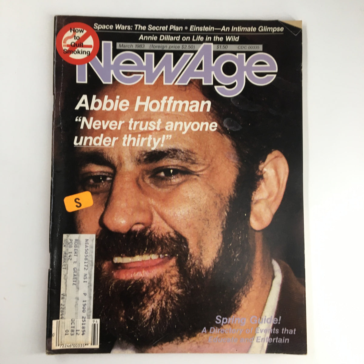 Cover of VTG NewAge Magazine March 1983 featuring Abbie Hoffman with the phrase 'Never Trust Anyone Under Thirty' prominent on the front, showcasing historical counterculture themes.