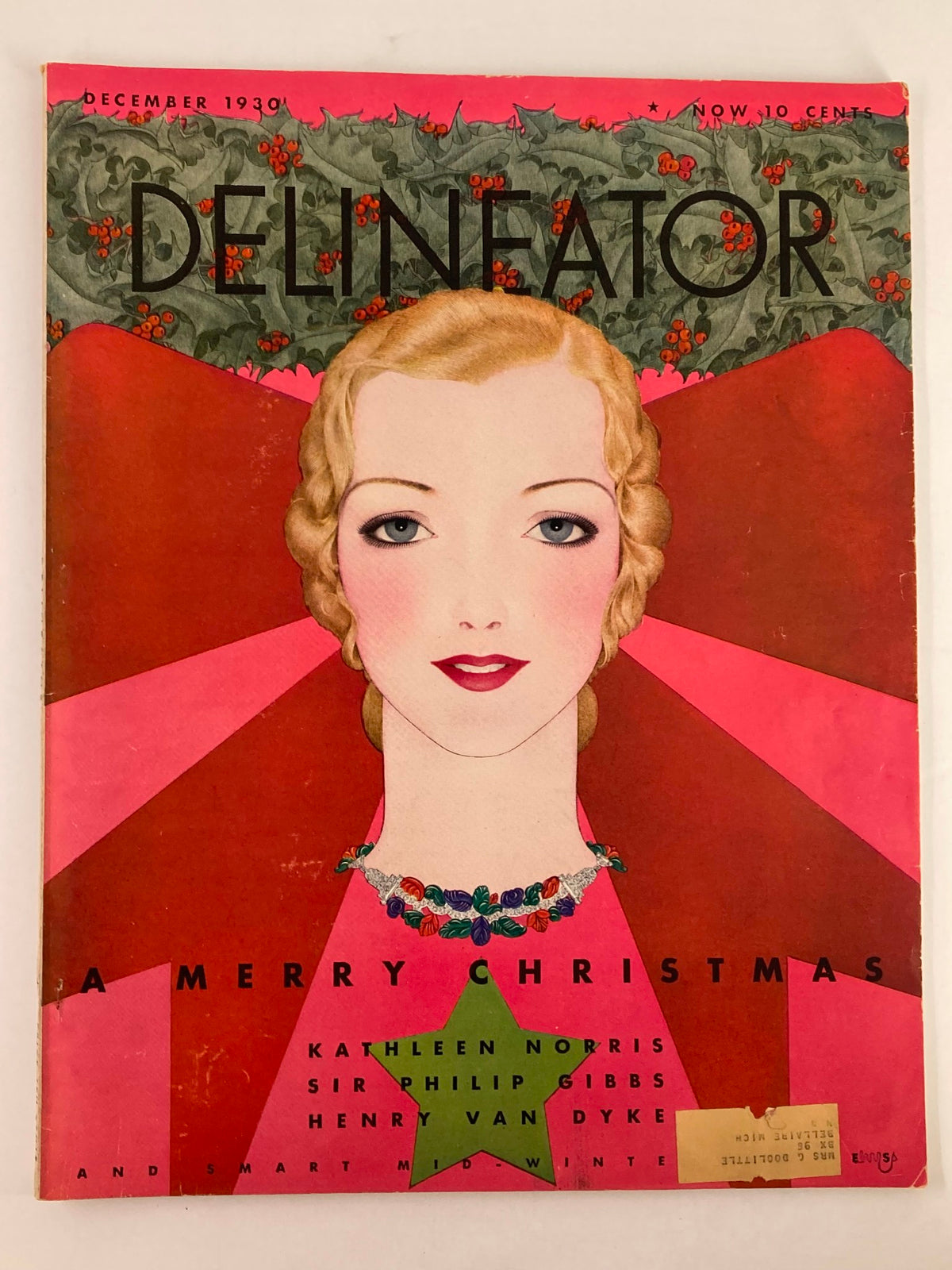 VTG Delineator Magazine December 1930 Cover featuring a festive illustration for 'A Merry Christmas' by Kathleen Norris, showcasing an elegant woman with artistic design elements and holiday decor.