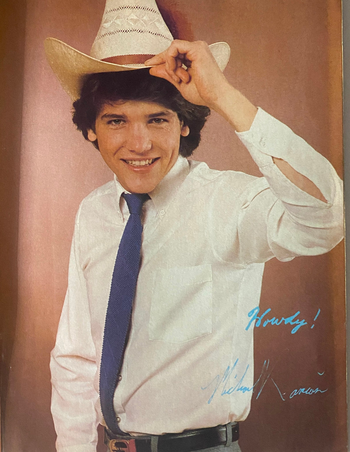 Photo of Michael Damian wearing a cowboy hat, featured in Tiger Beat Magazine September 1981, showcasing a friendly pose.